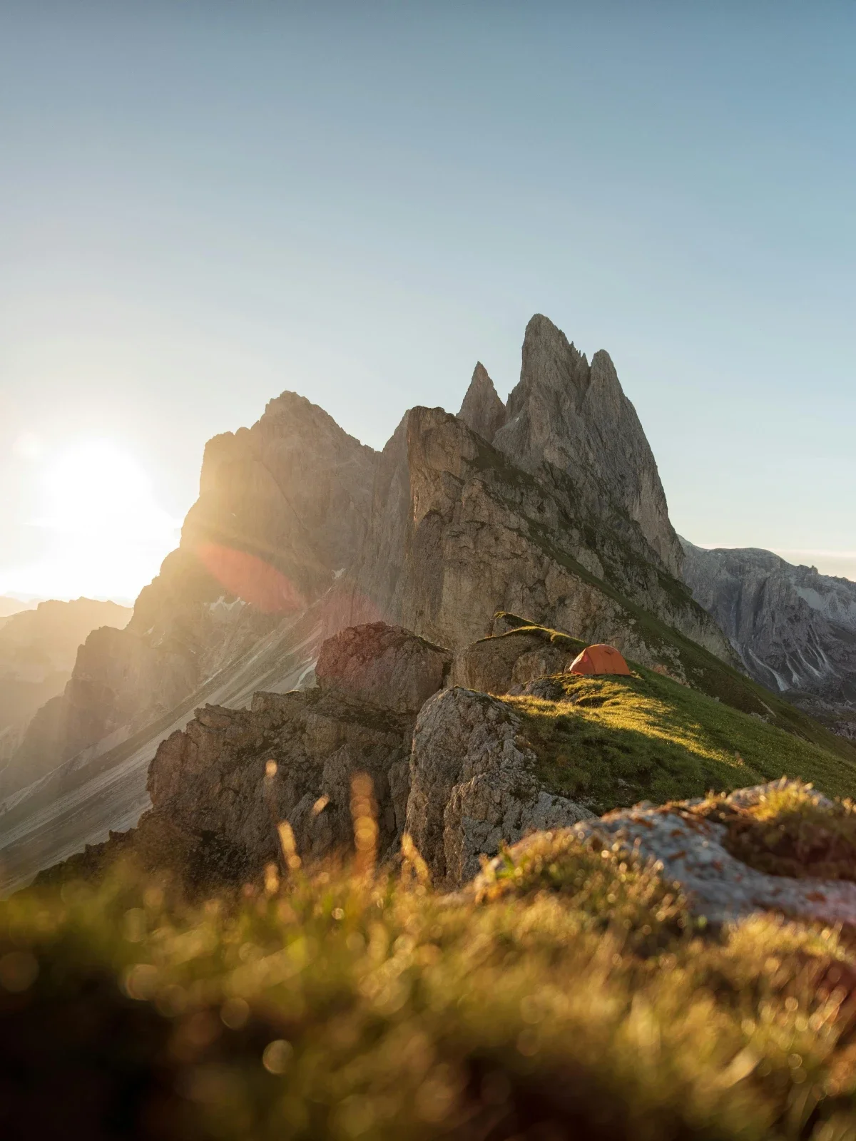  Winding road through Passo Sella with sweeping Dolomite cliffs and valley views. 