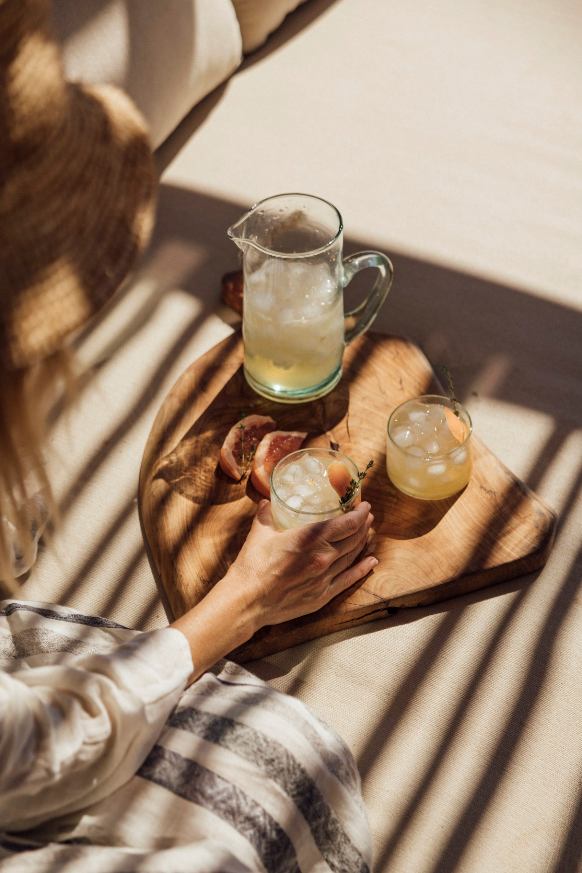 Guest at Agave House drinking iced grapefruit-thyme refresher.