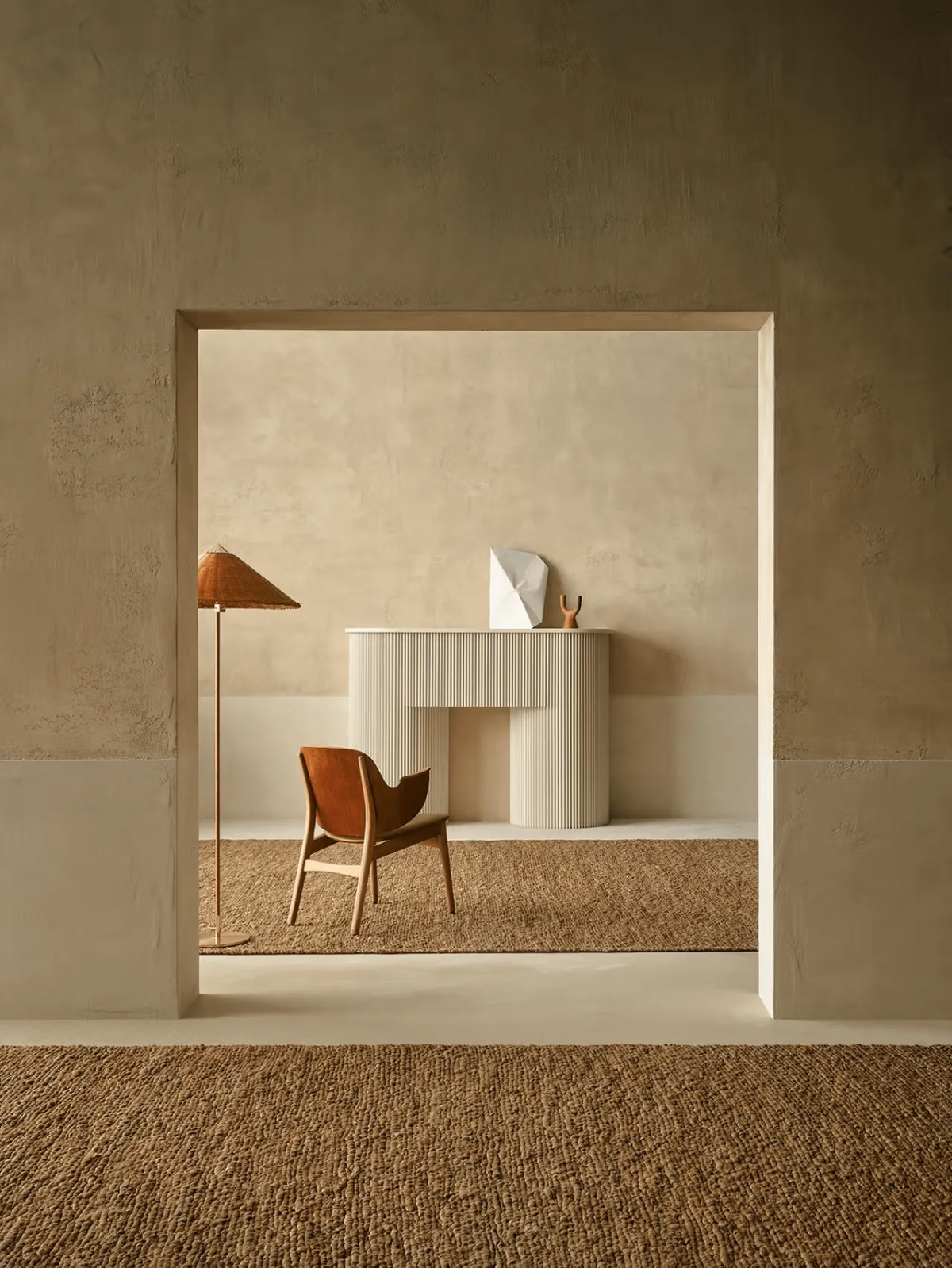 Warm minimalist room featuring Armadillo’s Mesa rug in natural jute.