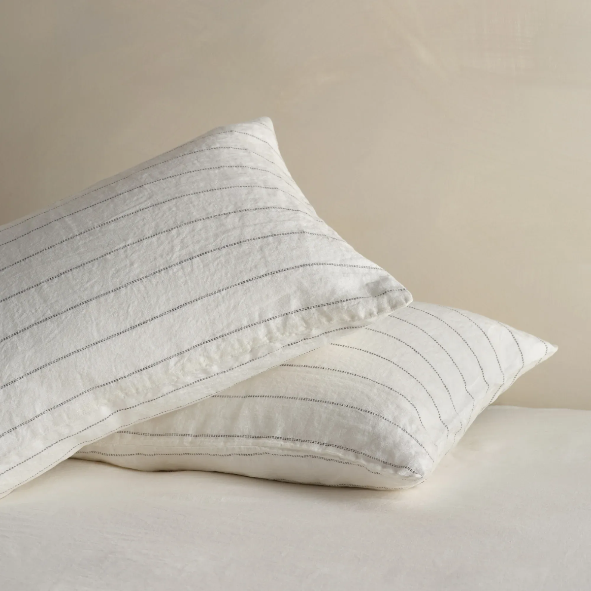 Set of Bedfolk linen stripe pillowcases.