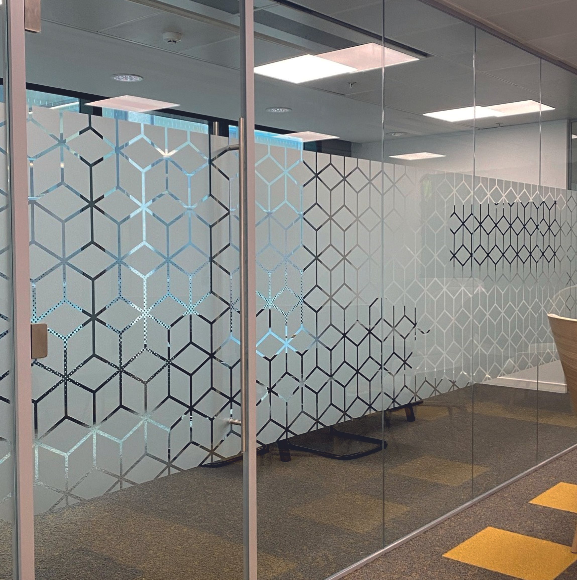 Office space with glass partitions featuring geometric patterns. Frosted Vinyl. Window Manifestations. Signmakers Cork & Kerry, Ireland.