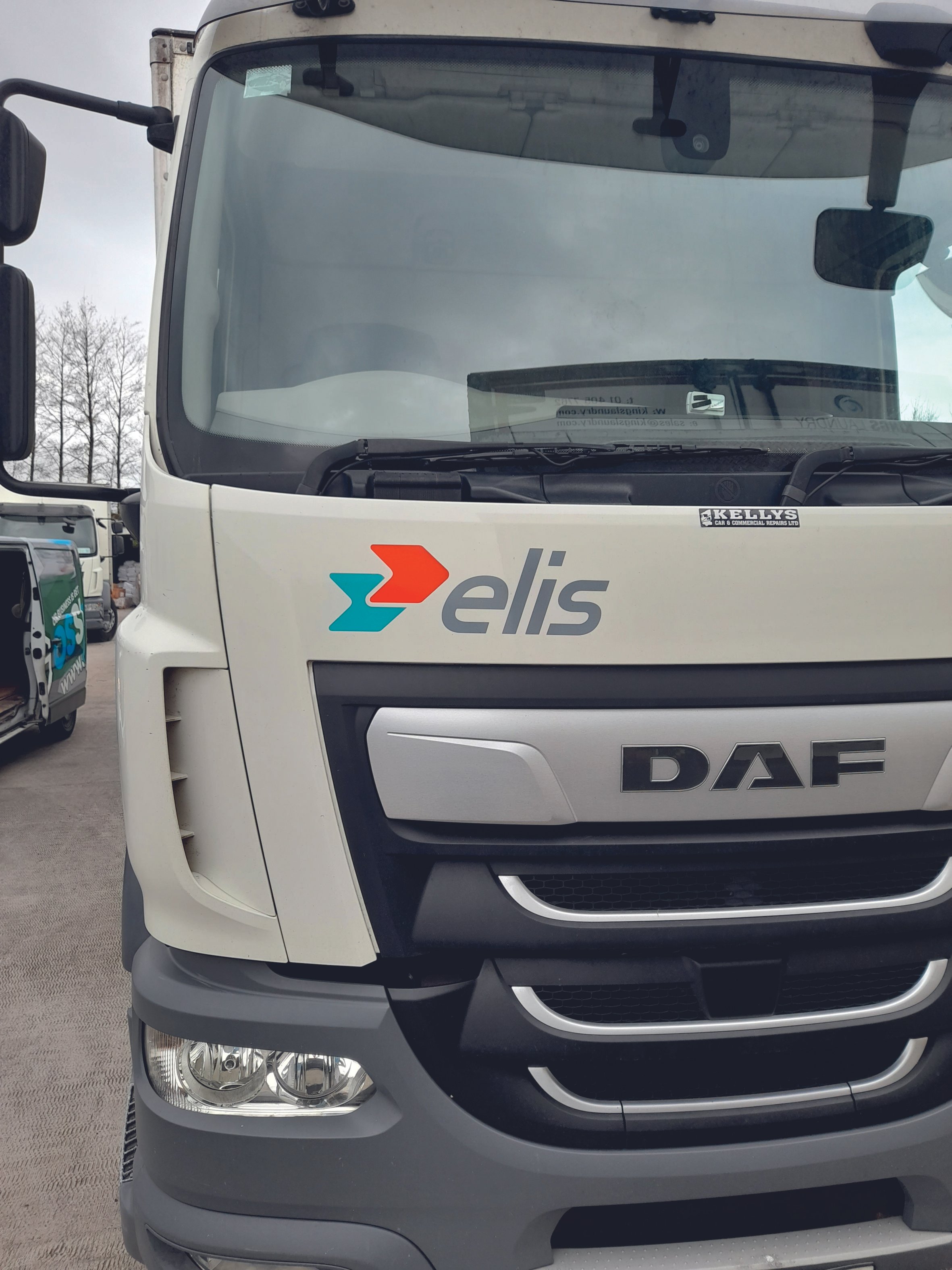 Front view of a DAF truck with logo on the windshield. Vehicle wrap. Vehicle Graphics. Commercial Vehicle Branding. Plant Hire Signage. Signmakers Cork & Kerry, Ireland.