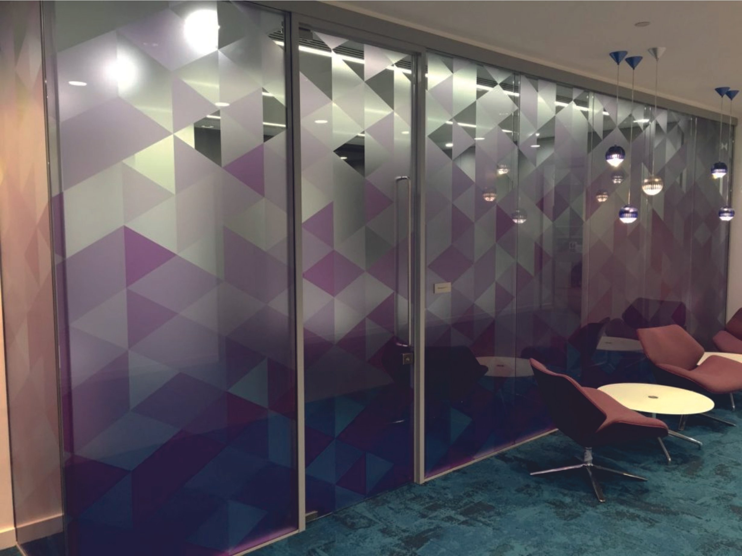 Printed Office space with glass partitions featuring geometric patterns. Frosted Vinyl. Window Manifestations. Signmakers Cork & Kerry, Ireland.