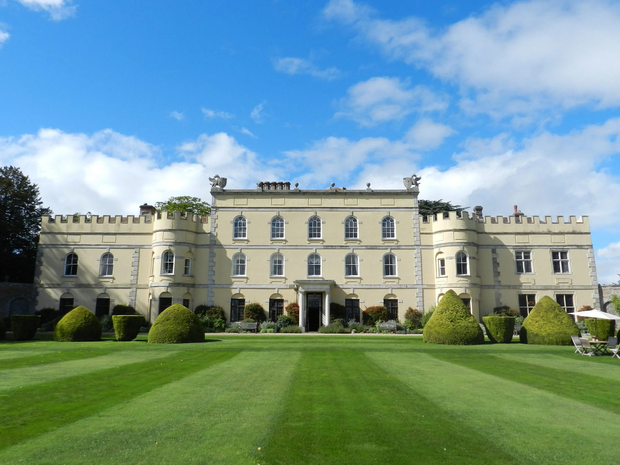The full frontage of Hampden House across its sweeping lawn