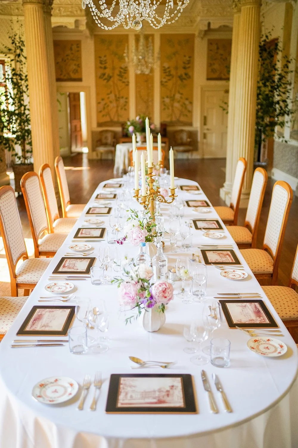A long dining table laid for a private gathering at Hampden House