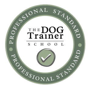 Circular logo for The Dog Trainer School with green and white colors, featuring a checkmark in the center and the text 'Professional Standard' around the outer ring.
