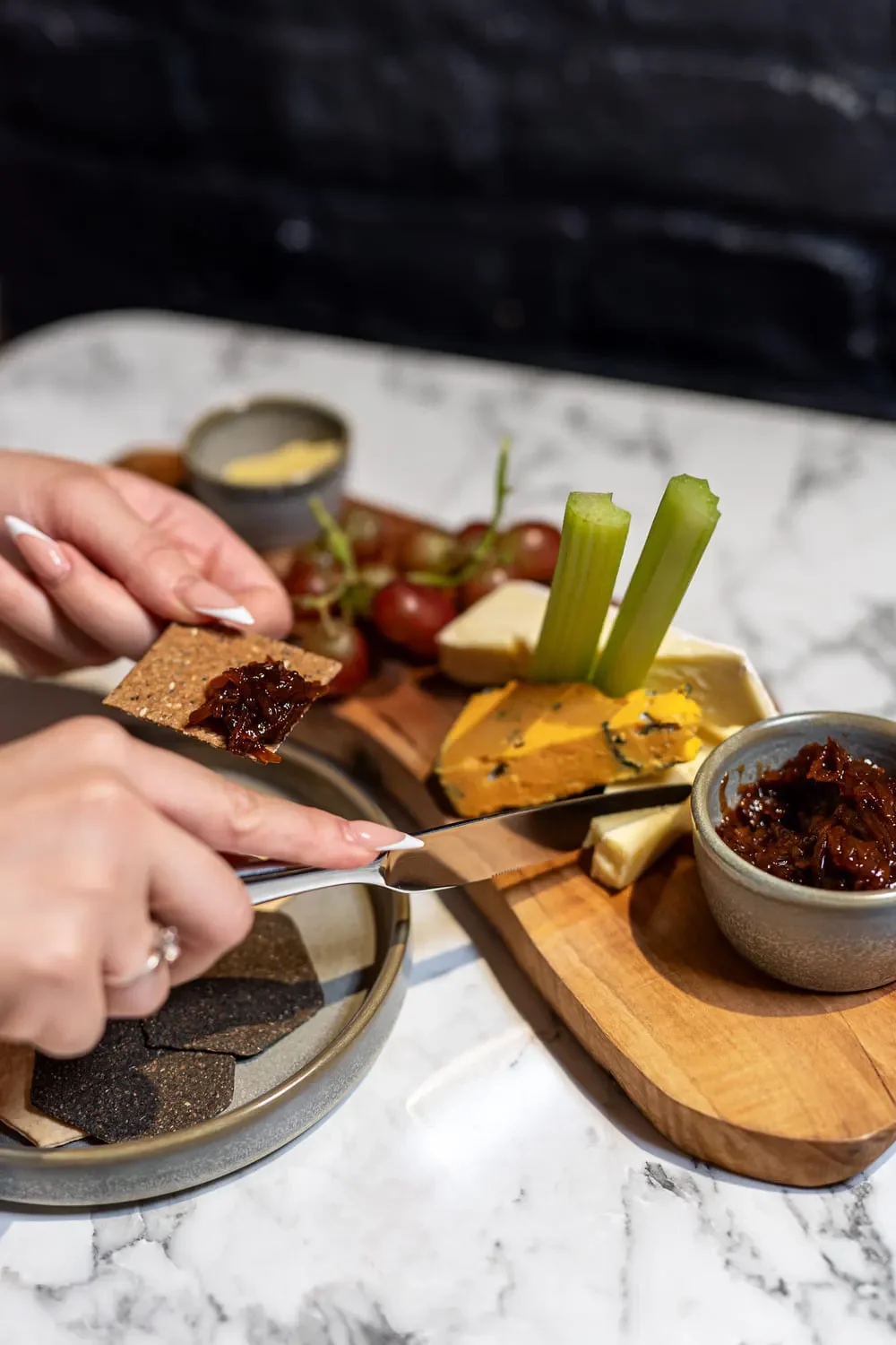 A guest tucks into the British cheese board at Derby's The Engine Room restaurant