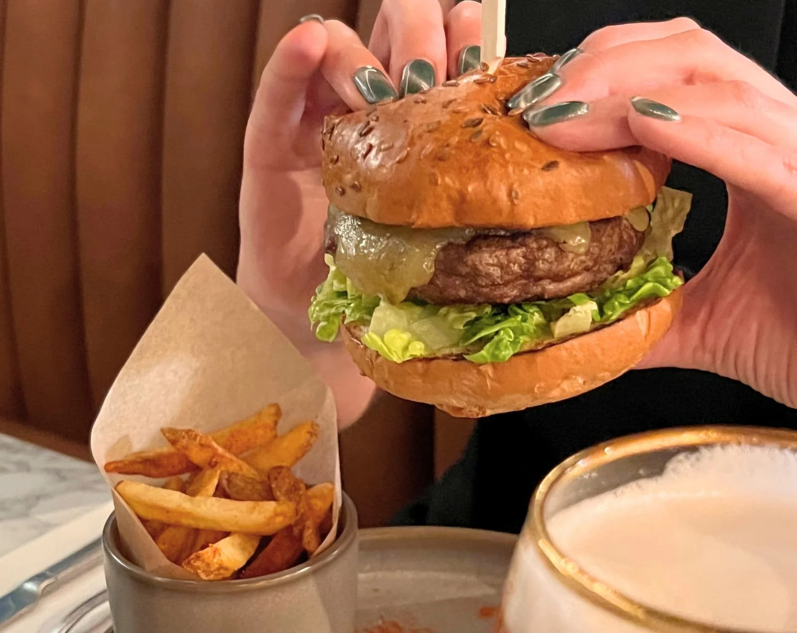Cheeseburger with smoked bacon jam, Monterey Jack cheese and smoked paprika fries from The Engine Room lunch menu.