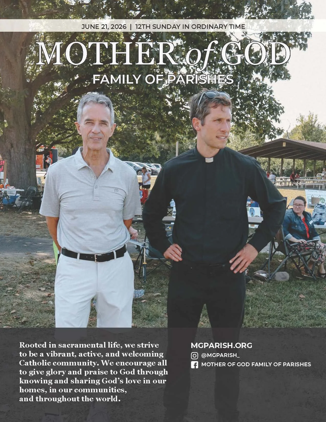 Photograph of two men outdoors at a community event, one dressed in a clerical shirt and the other in casual attire, with a large tree and several people sitting and standing in the background. The image promotes the Mother of God Parish community, with text overlay about the church's mission and contact information.