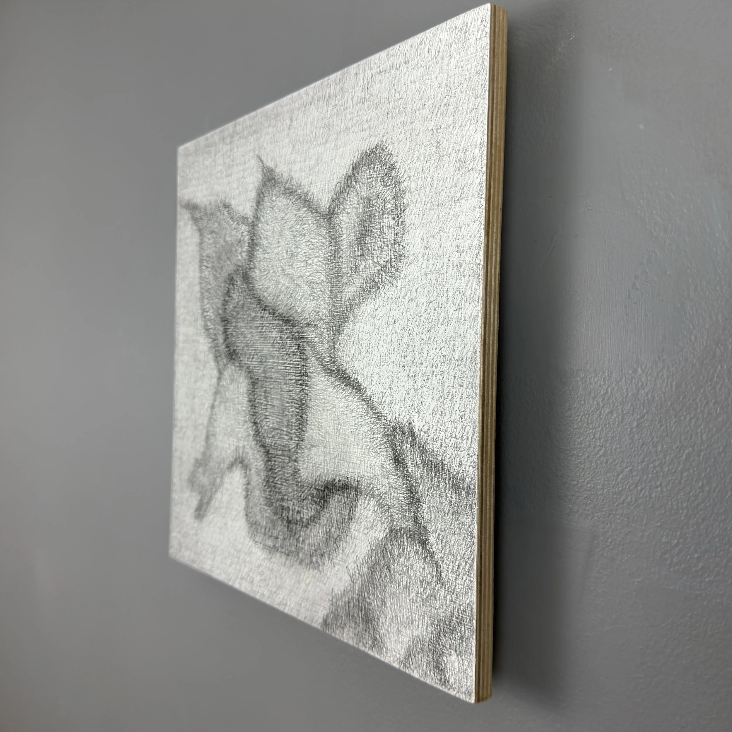 White abstract art in square shape created using pencil journaling to create shapes Side View