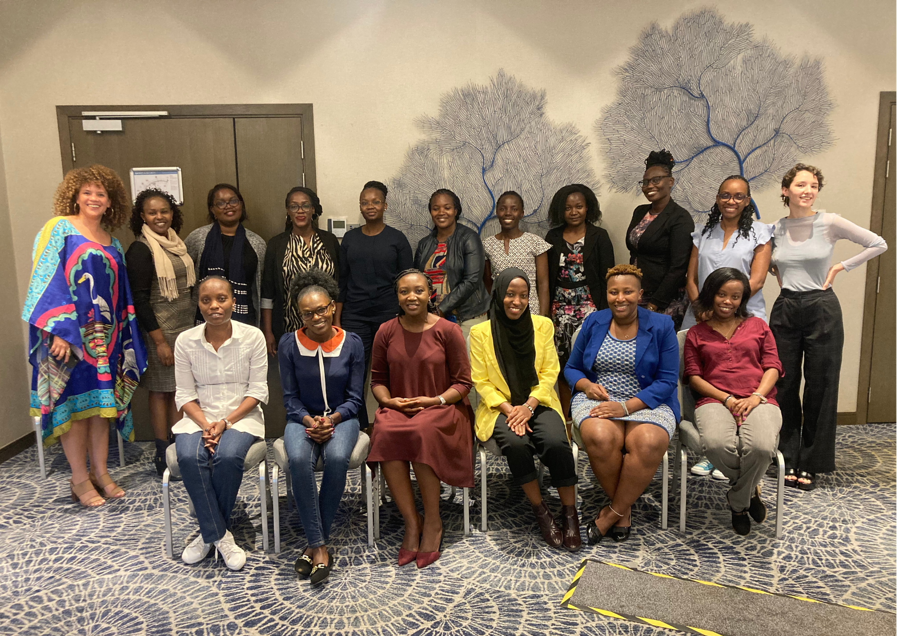 Workshop participants and facilitators posing for a photograph together.