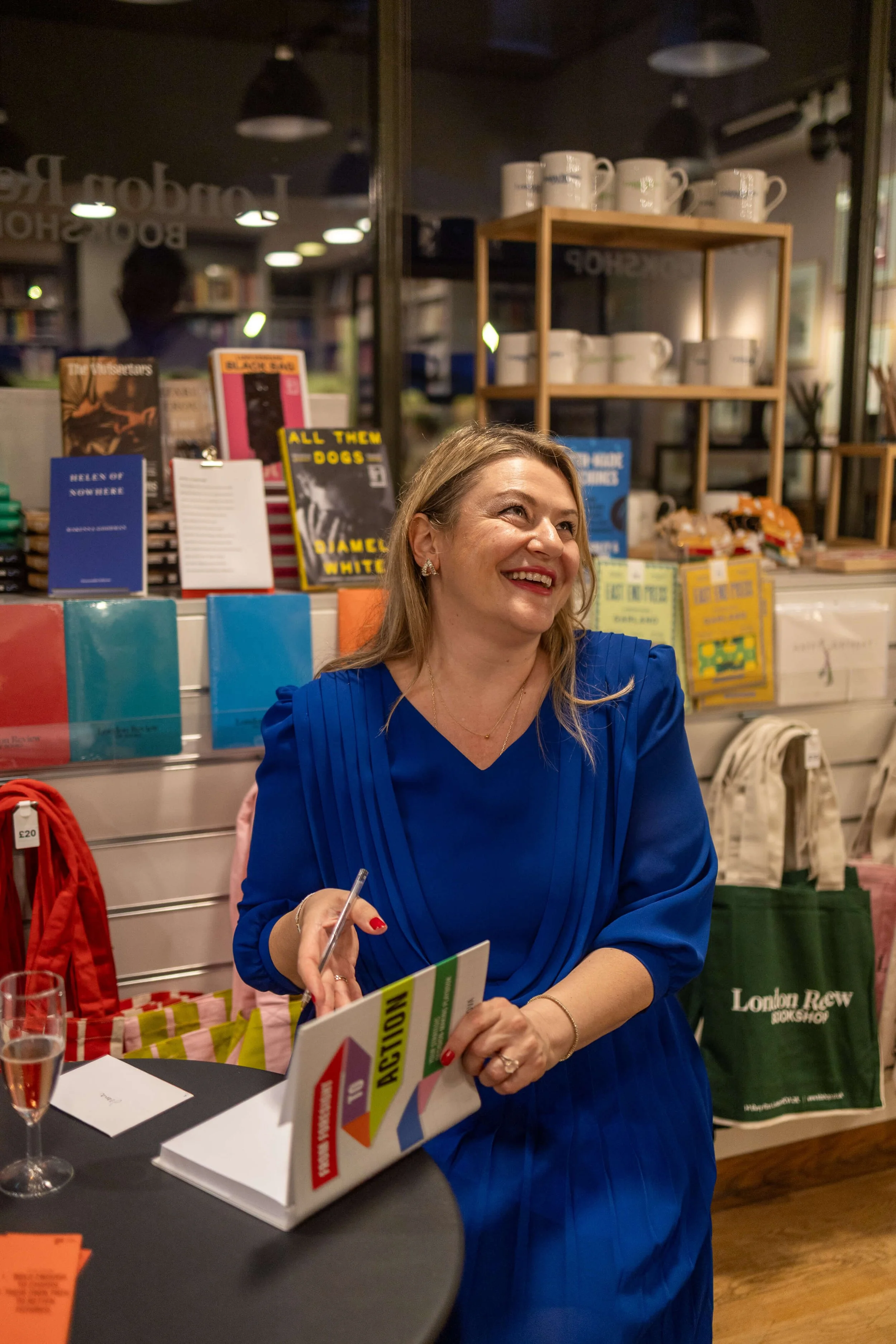 Joana Lenkova holding her book at London Review Bookshop