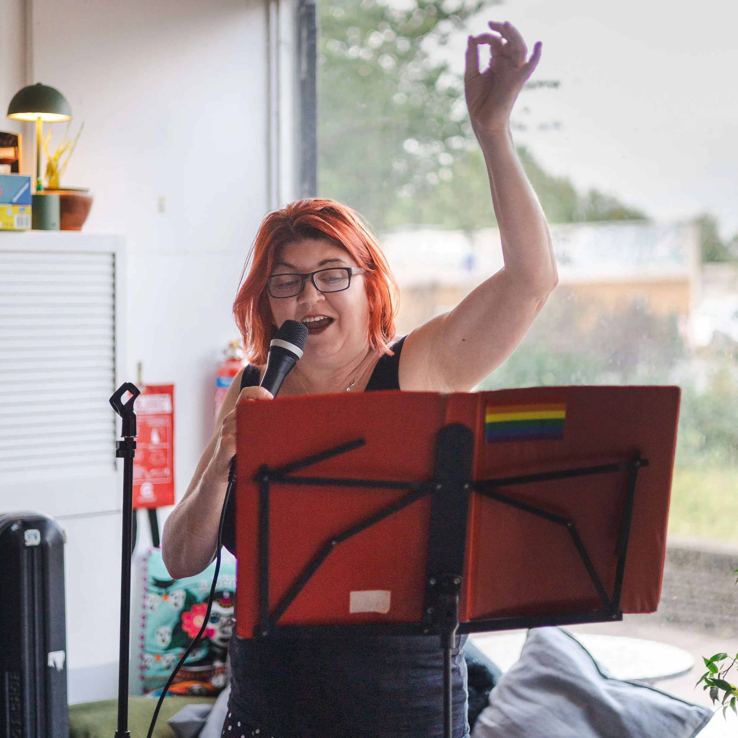 Singer performing at a community celebration at the waterintobeer brewery in London.