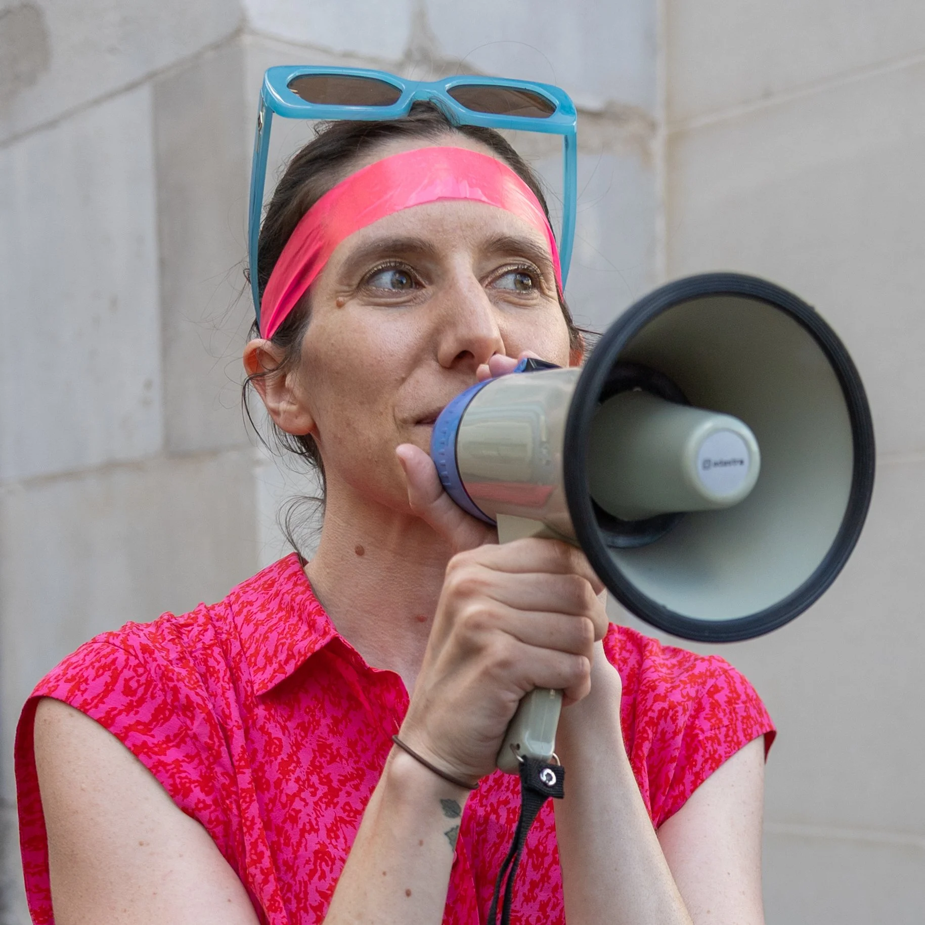 Creative female professional photographed in London during an urban game event.