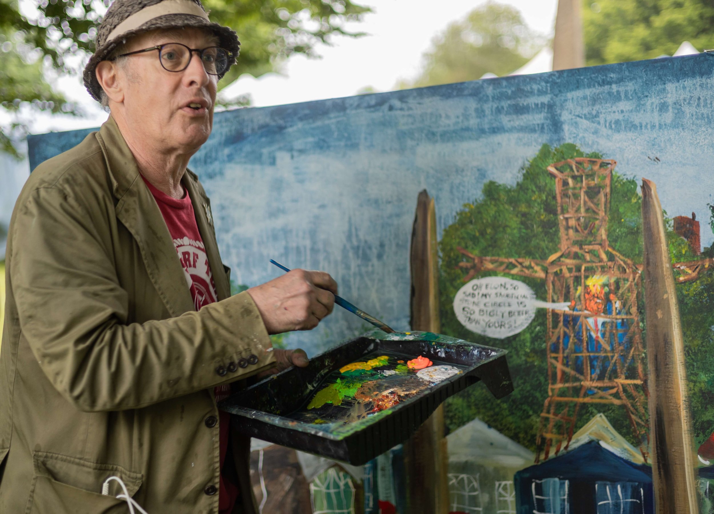 Martin Rowson creating a live painting at Max in the Park.