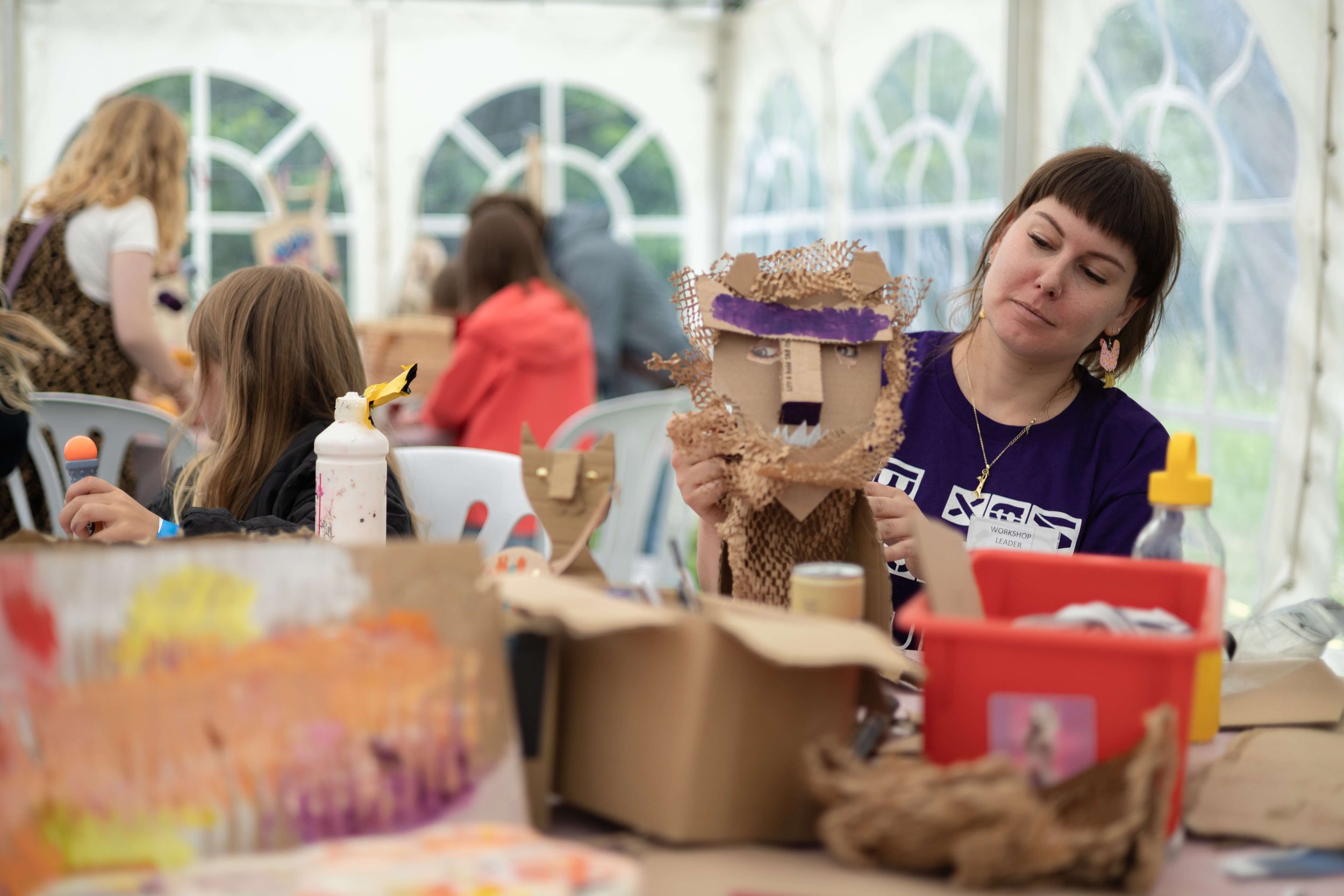 Children taking part in arts and crafts at a Max in the Park.