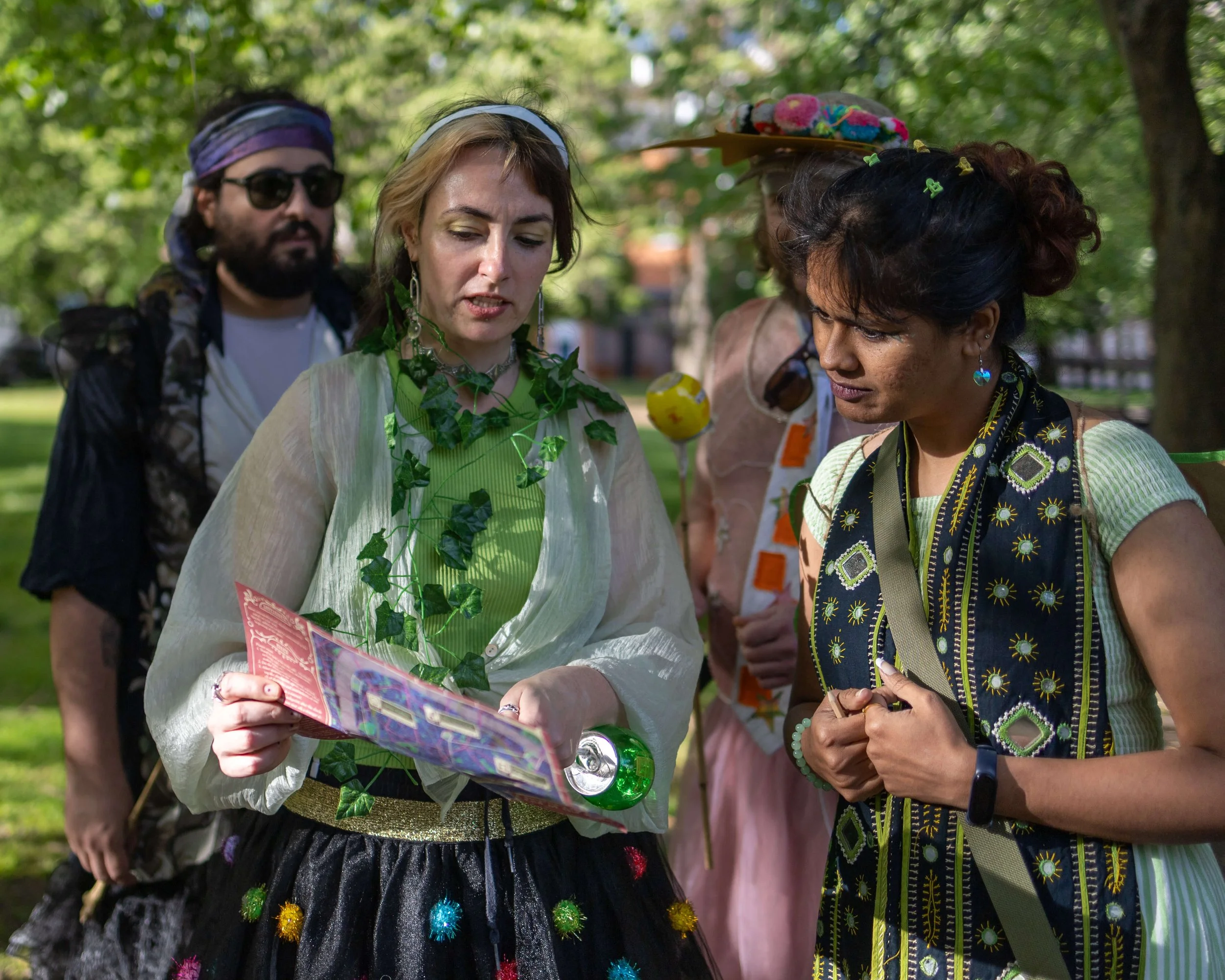 Participants following a map during an interactive outdoor community event in London.