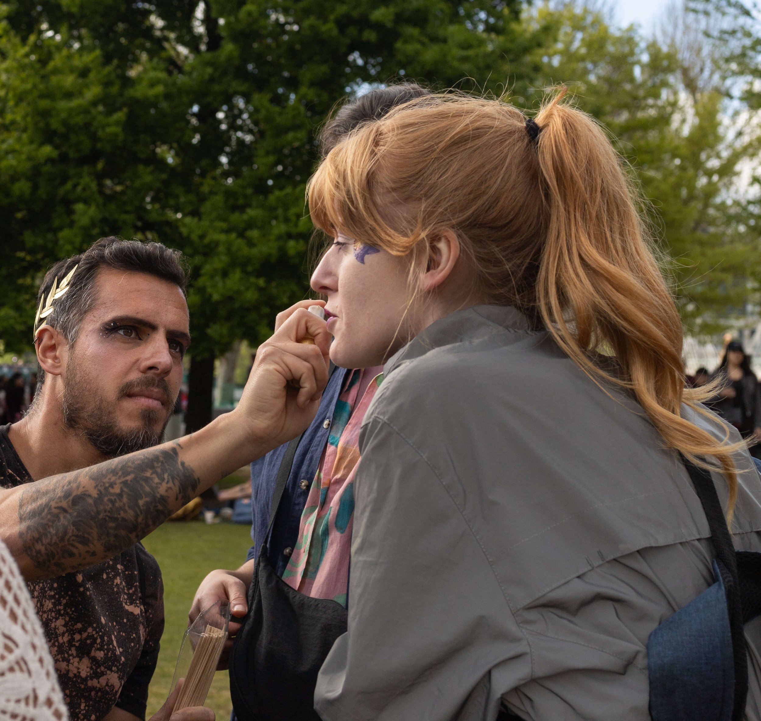 Face painting at a family-friendly community festival in London.