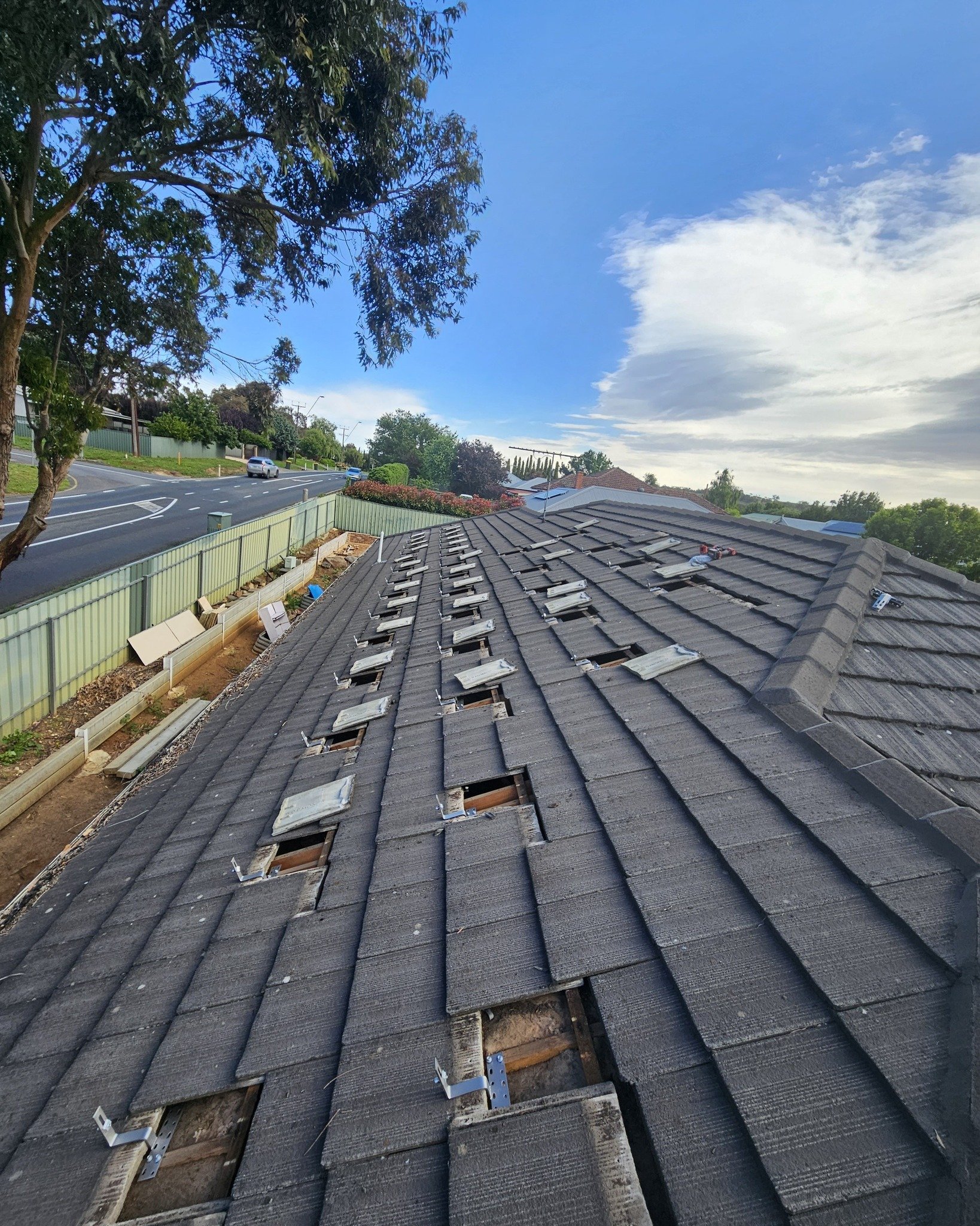 Preparing a tiled roof for solar panel installation requires precision and care. By carefully grinding the tiles to accommodate mounting brackets, we ensure a secure fit without compromising the roof's integrity. This meticulous preparation lays the 