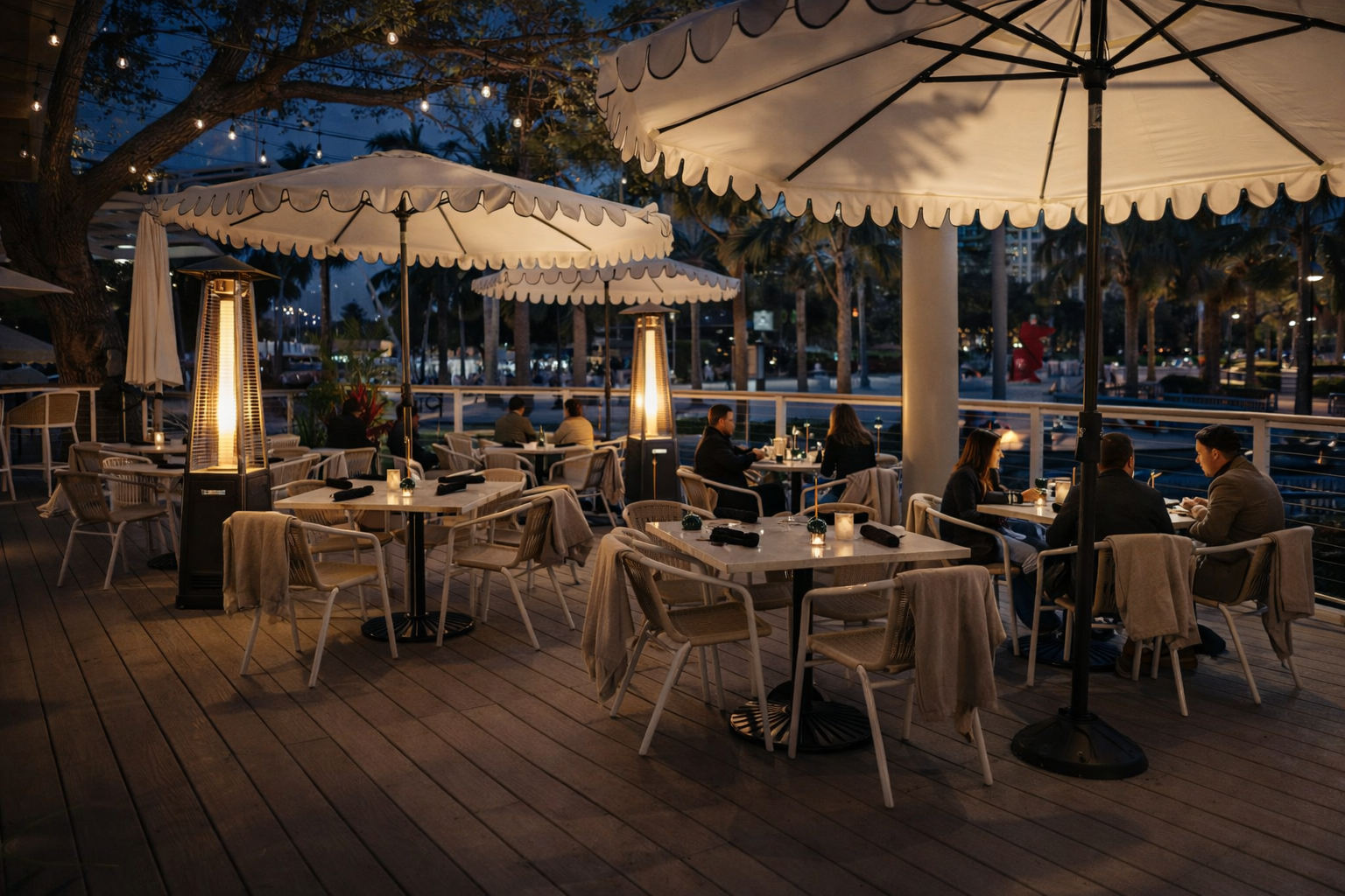 Outdoor dining at Perry’s St. Pete with patio heaters on a cool winter evening in downtown St. Petersburg