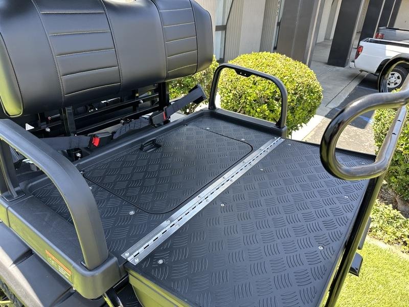 Rear flip seat transforms into a cargo deck for coolers and gear.