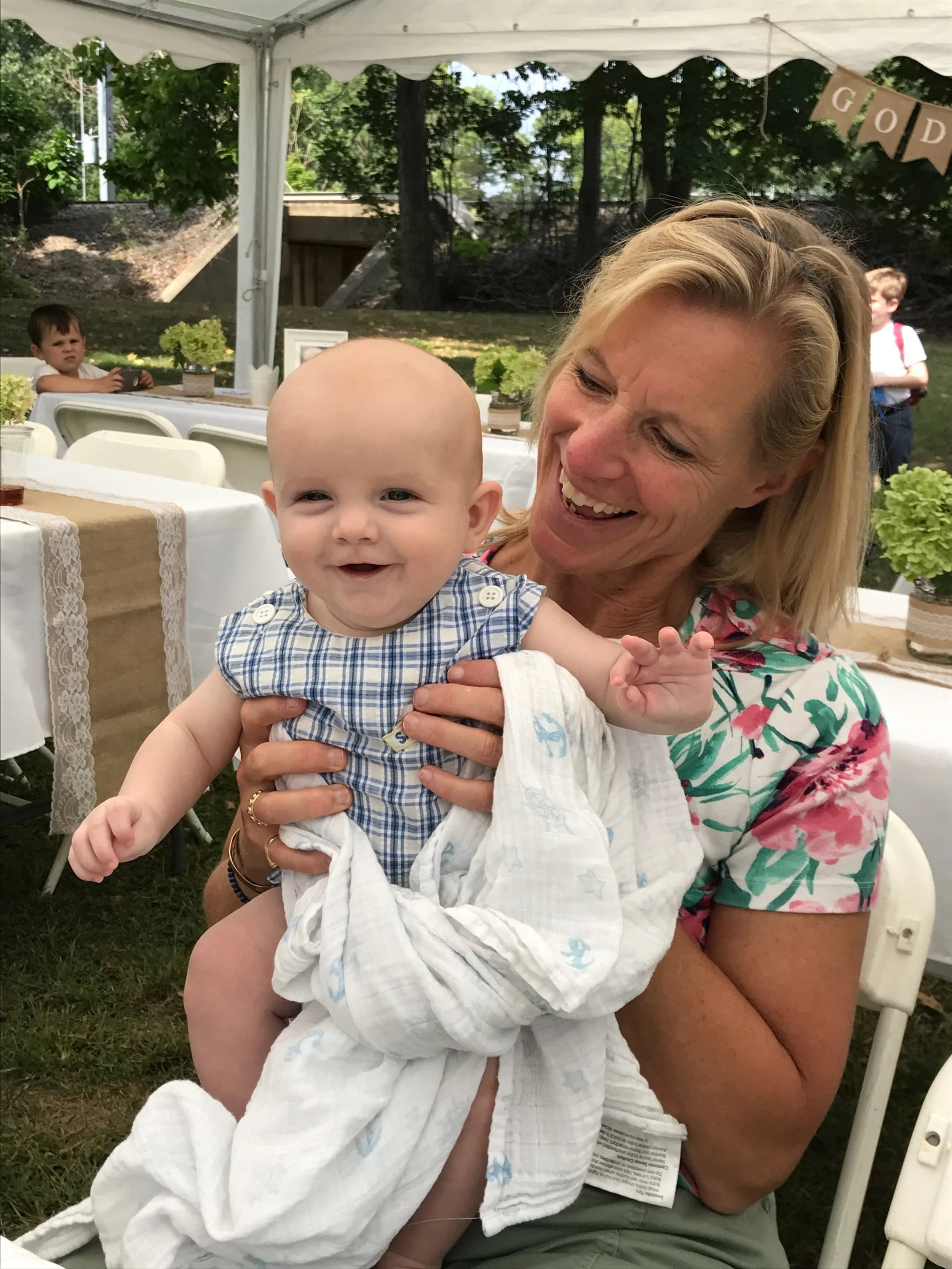 Smiling woman with baby