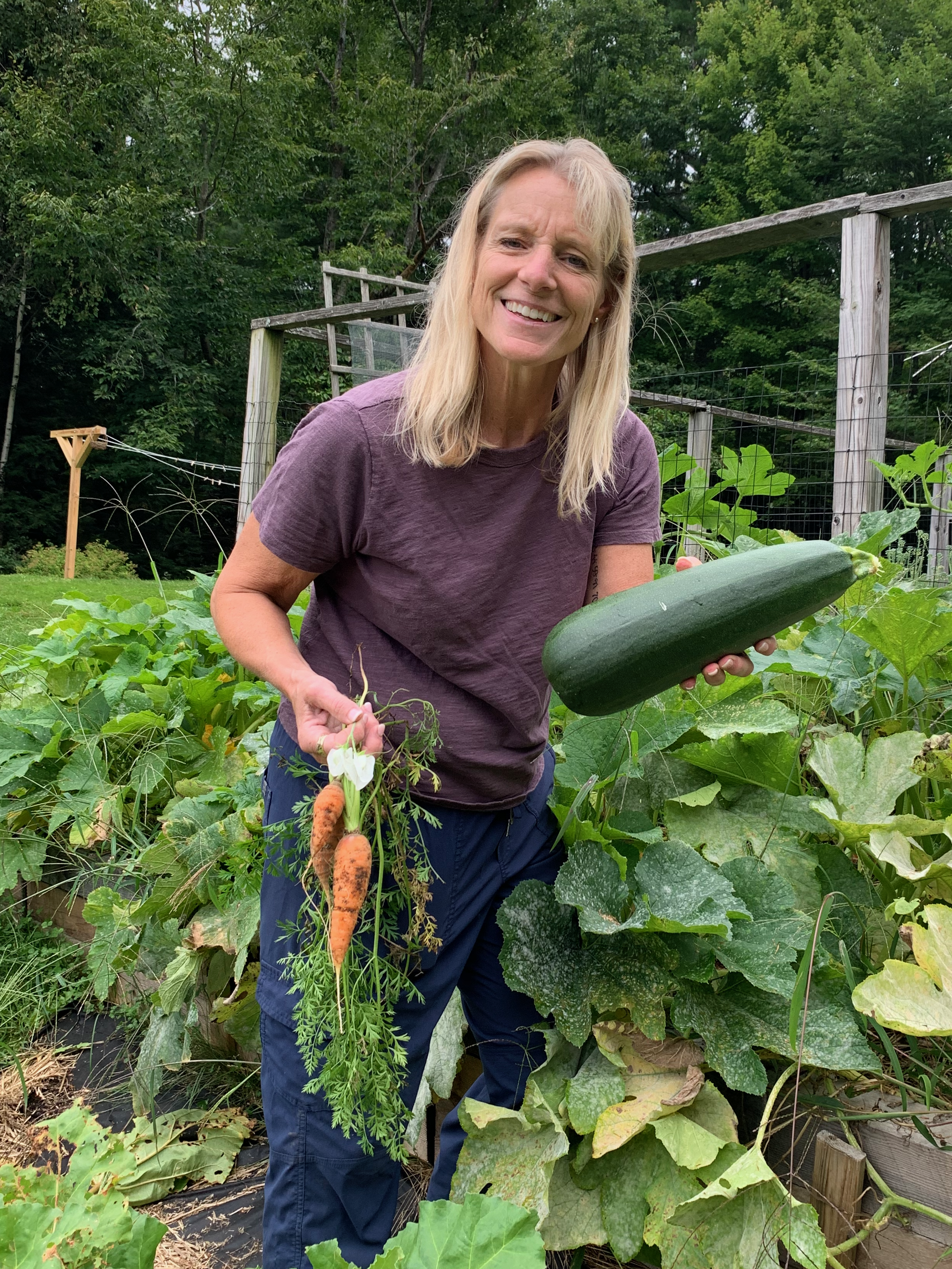 Happy woman in Maine with vegetables