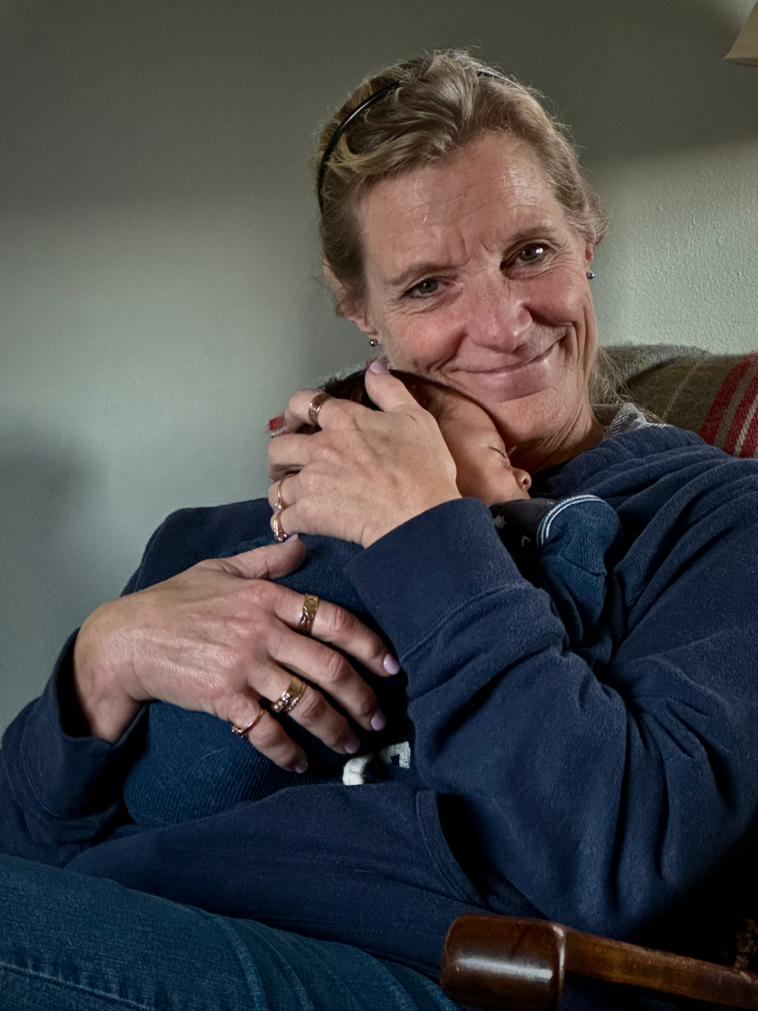 Labor and Birth doula holding newborn infant