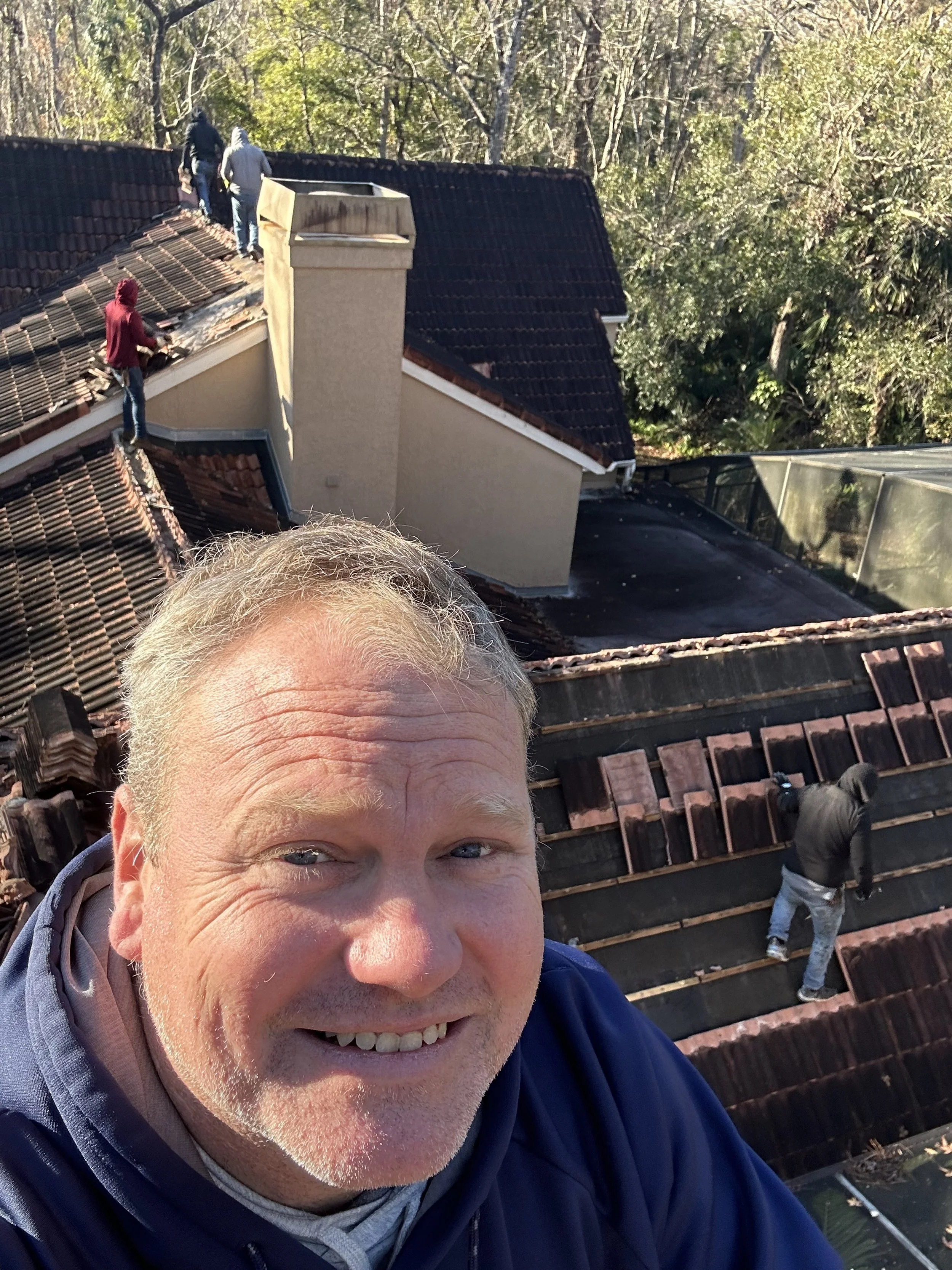 “Tile roof tear-off with exposed decking during replacement in Altamonte Springs, Florida”