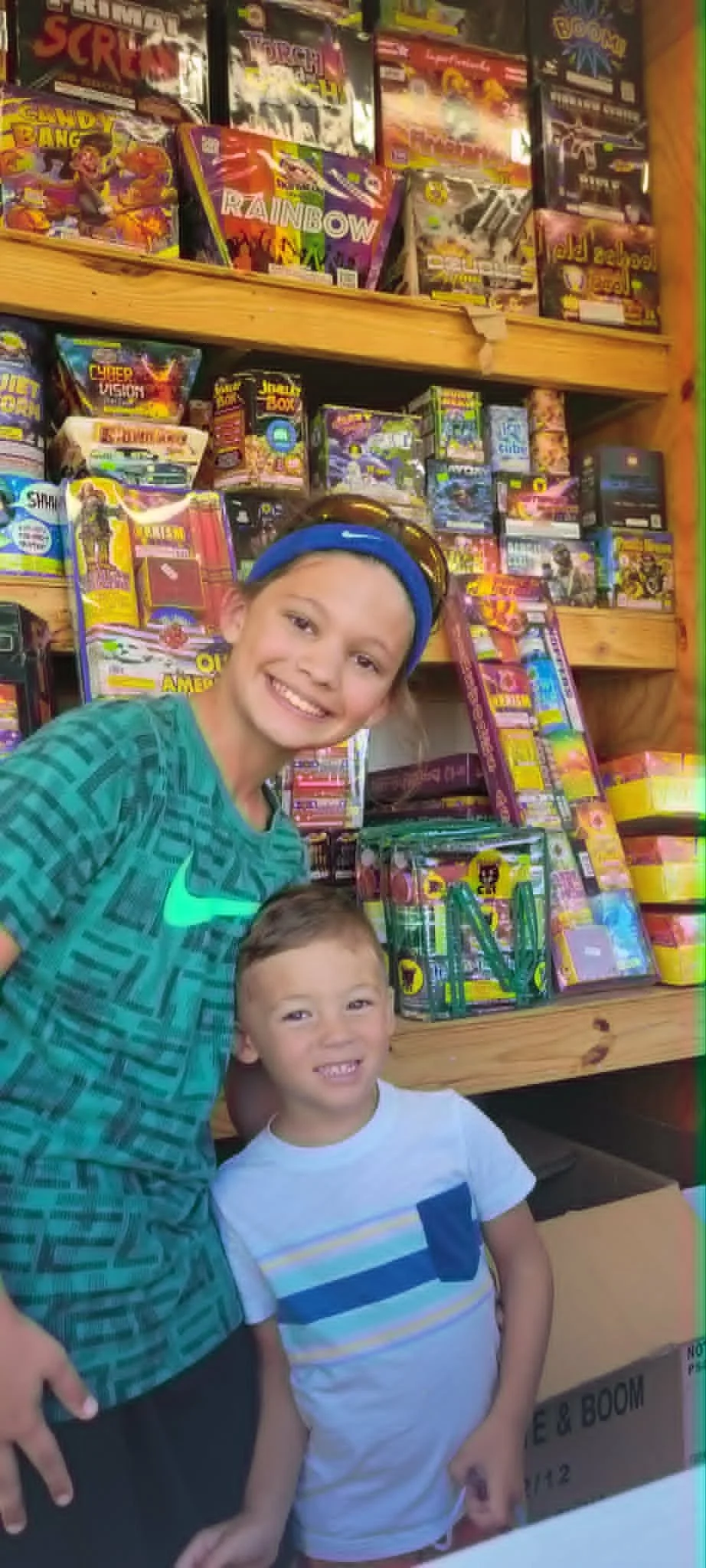 Family shopping with a large selection at a fireworks stand near Houston TX