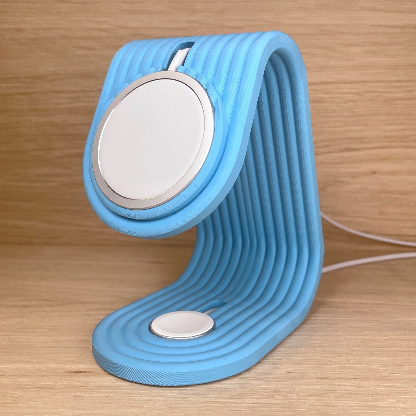 Elegantly designed. Expertly printed.

This iPhone &amp; Apple Watch charging stand combines clean aesthetics with practical function - a brilliant file brought to life on our printers.

See the original design here:
https://makerworld.com/en/models/