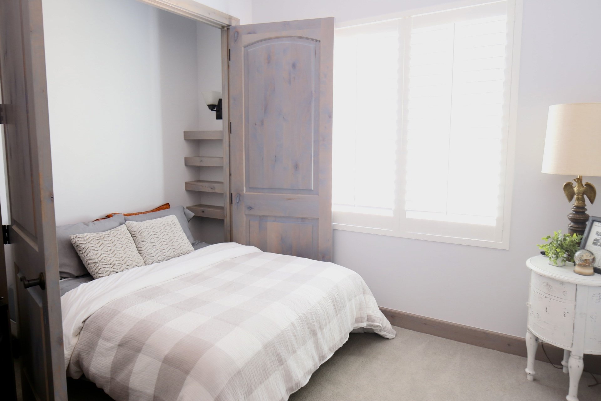 The Caddie & Cowboy Room is light and airy with a cozy queen bed.
