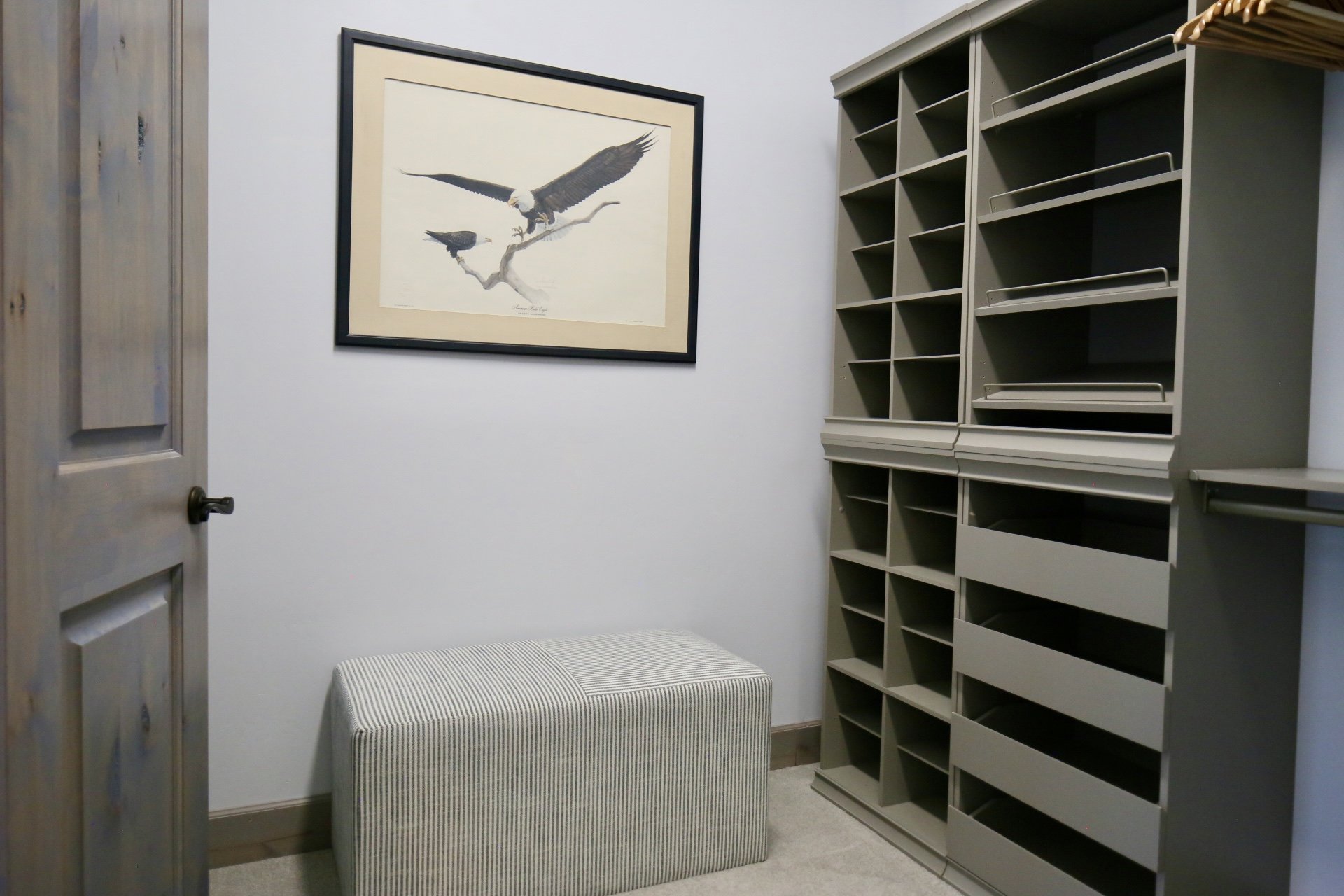 There's a huge walk-in closet in the Clubhouse Suite with 2 seating ottomans and custom closet system.