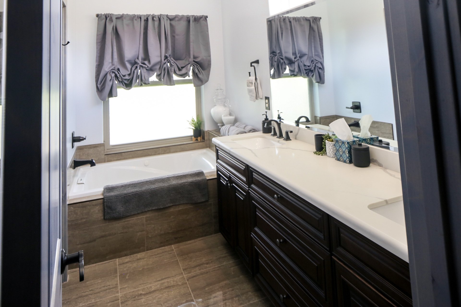 The Clubhouse En-Suite Bathroom provides ample space for a relaxing spa day or room for a couple to share.