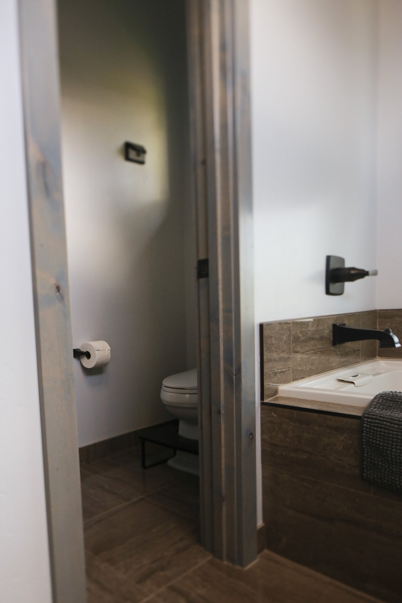 The Clubhouse En-Suite Bathroom offers a private toilet room with bidet and squatty potty.