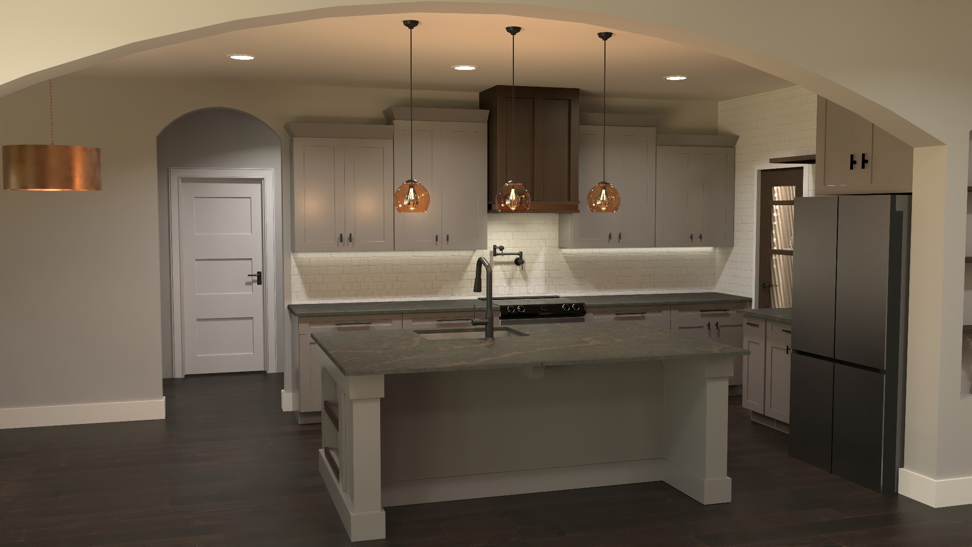 Modern kitchen with gray cabinets, dark countertops, island, pendant lights, and stainless steel refrigerator.