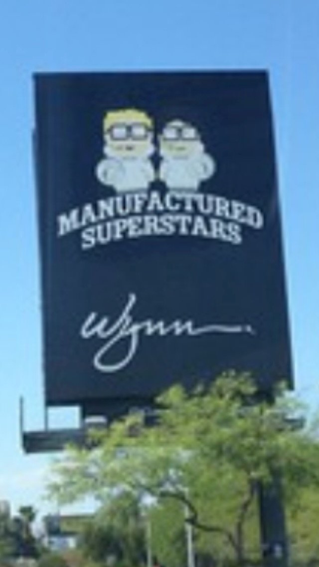 Billboard for Wynn featuring cartoon characters and the text 'Manufactured Superstars'.