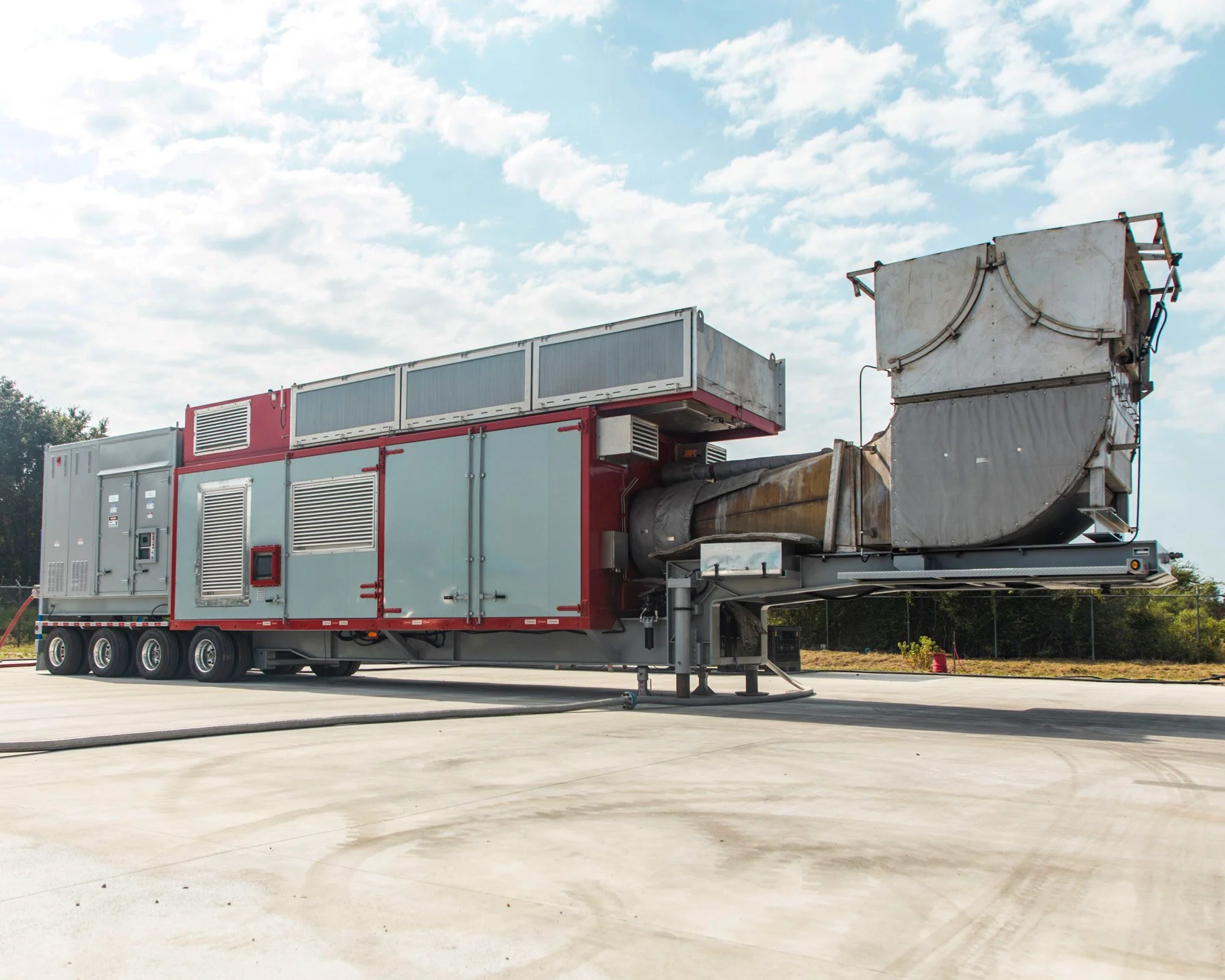 Interlink GT4.0 mobile gas turbine generator mounted on a road trailer, parked outdoors at facility.