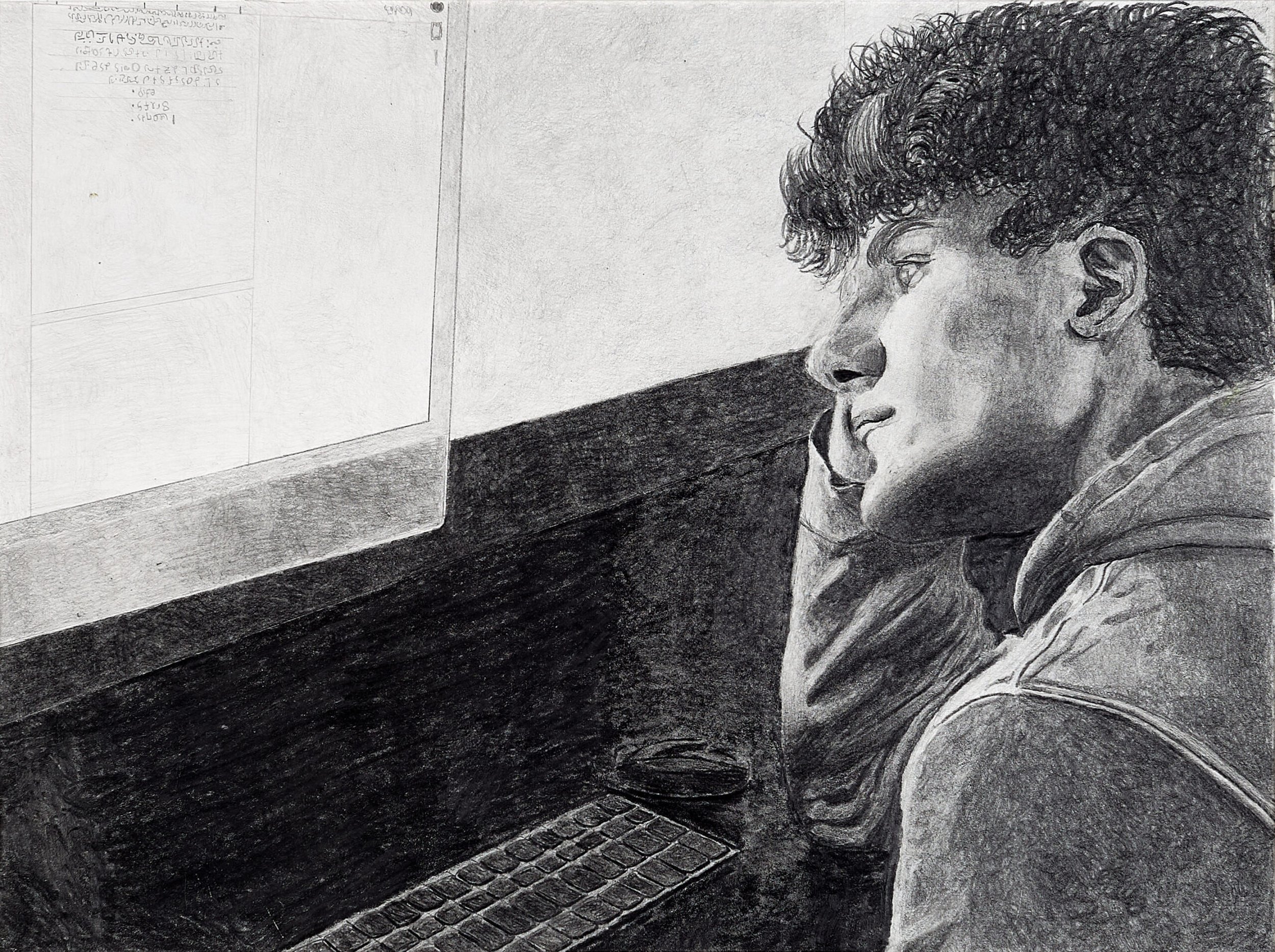 A black and white drawing of a young man with curly hair sitting at a desk, looking at a computer screen.