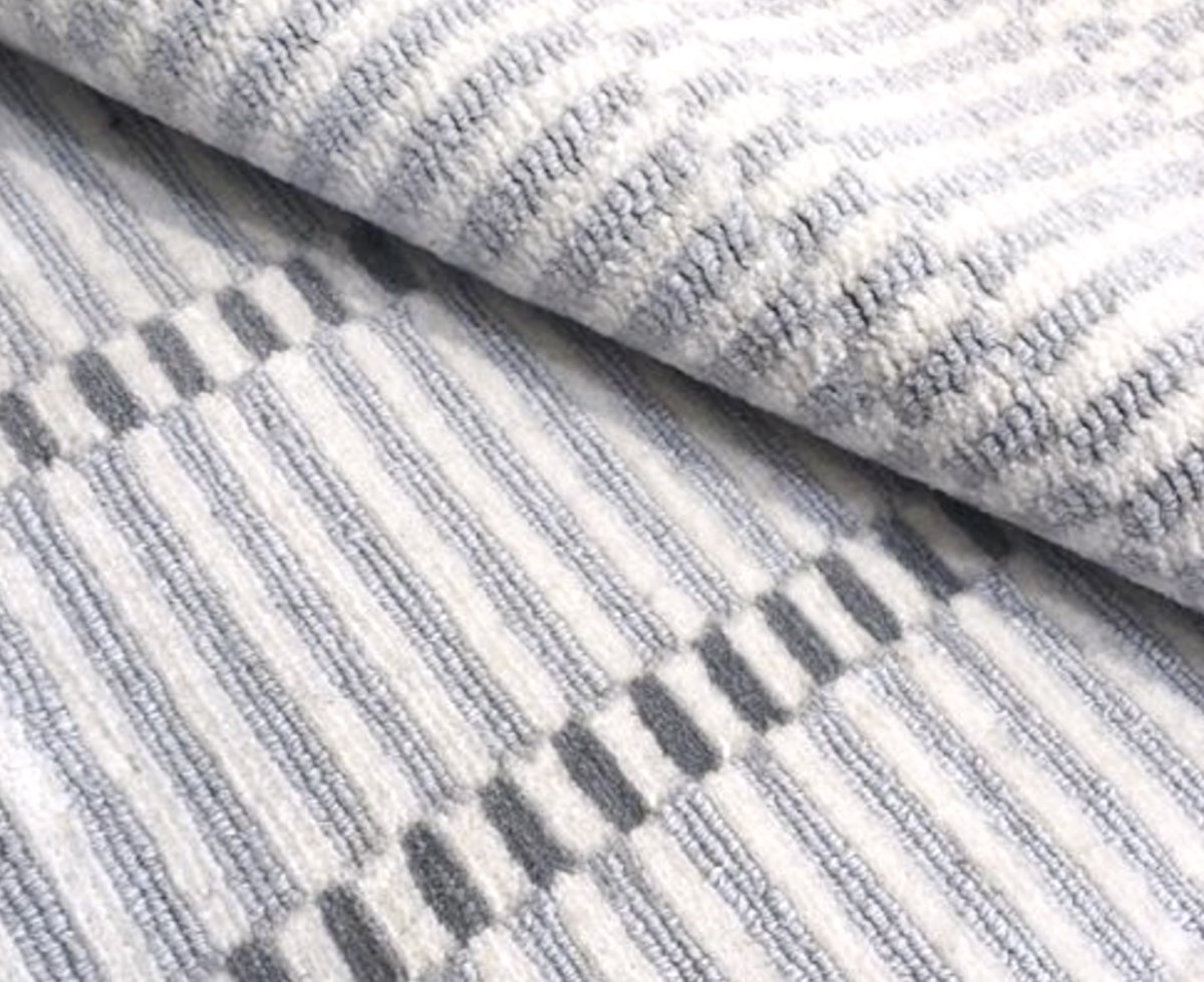 Close-up of a textured striped rug.