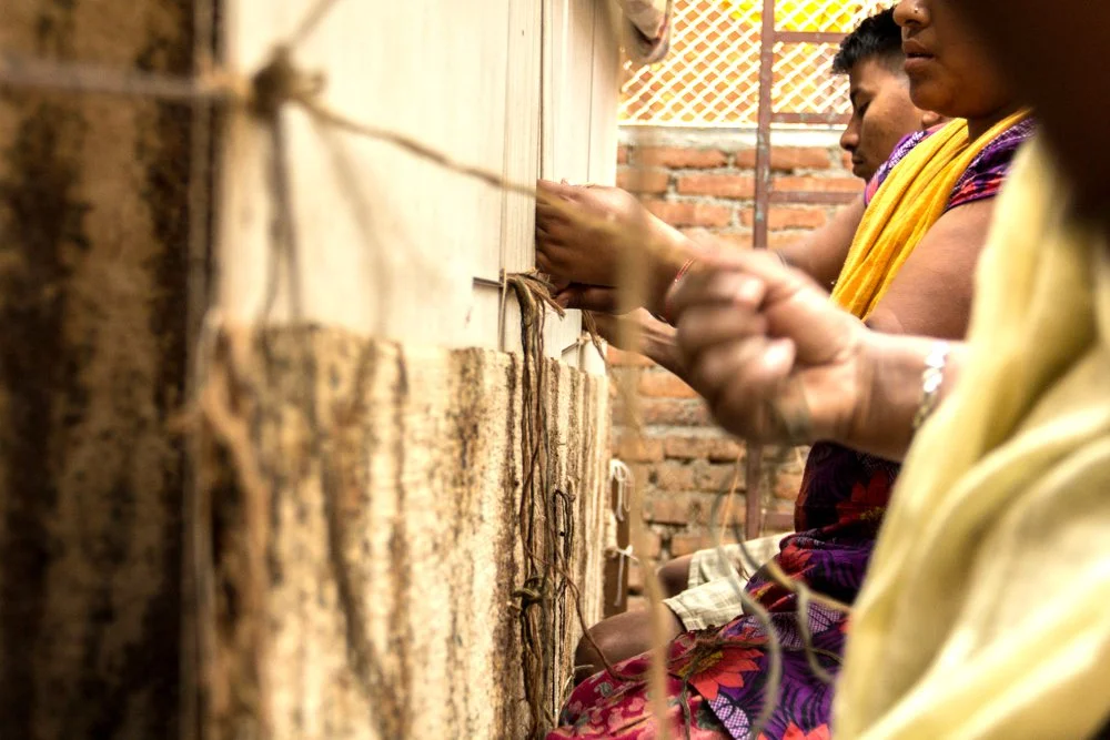 Weavers with Charlotte Batik Design