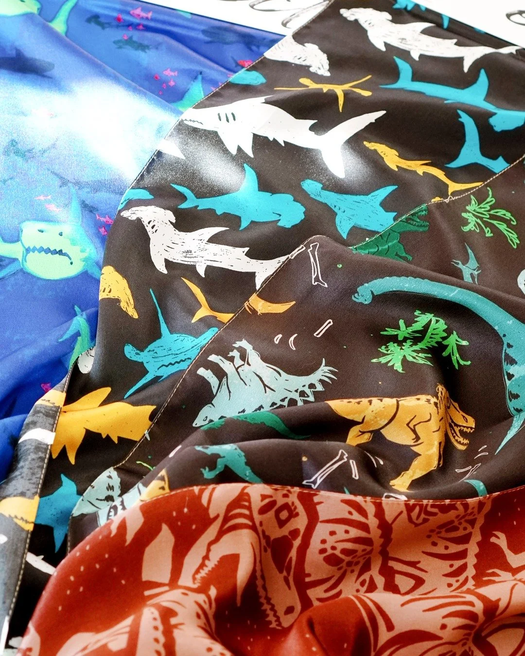 Imagine dinosaurs on a kids' collection. Now imagine them on a fashion-forward adults' line. 🦕

The dinosaur prints in Curated Eclectic are for the brands smart enough to know that fun prints sell &mdash; at every age.

Charcoal with colorful dinos.