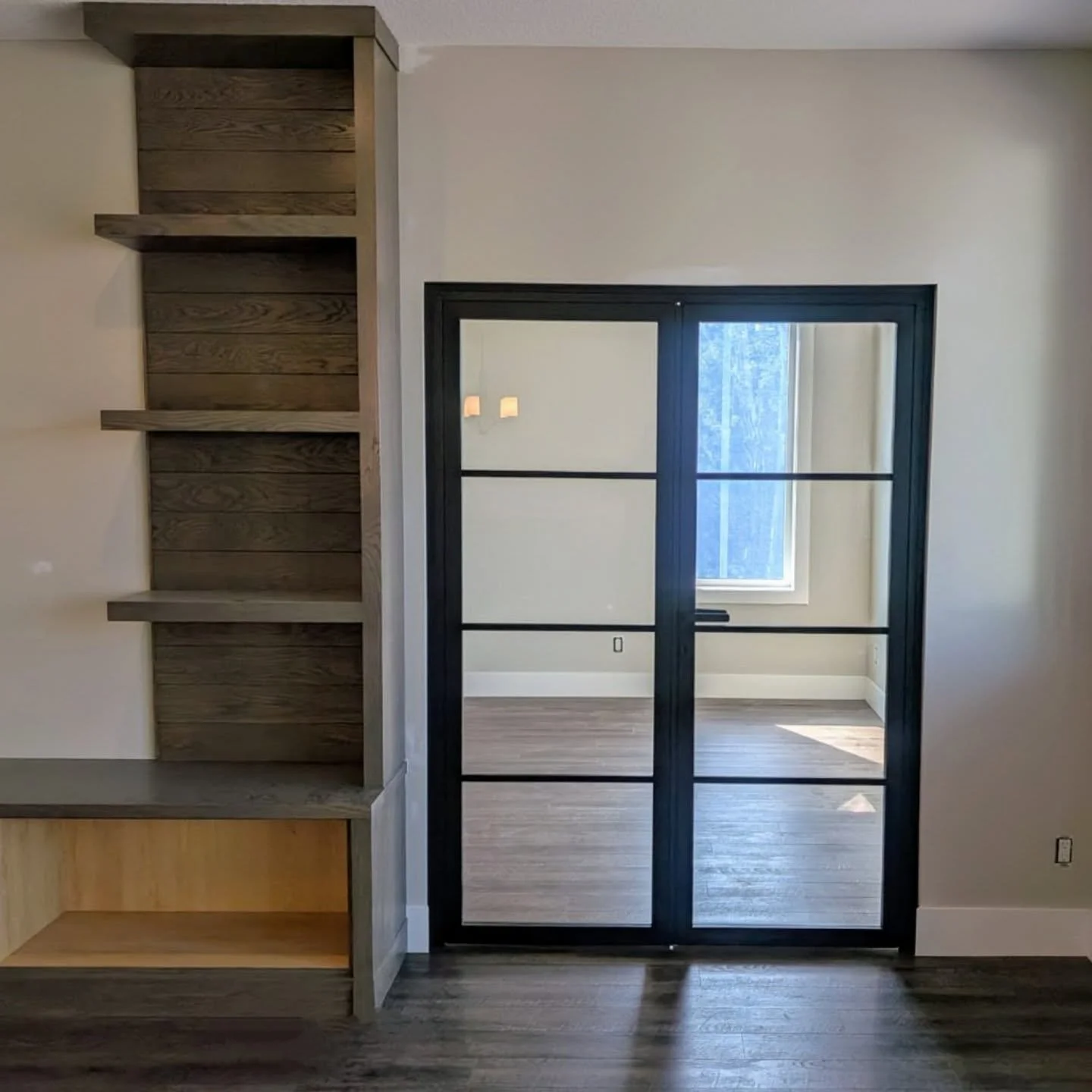 Our locking thin-profile aluminum framed doors add privacy and security to this main floor office. For additional privacy the glass panels could be frosted, fluted, or tinted.

#calgaryinteriordesign #interiordoors #glassdoors #calgarybuilders #calga