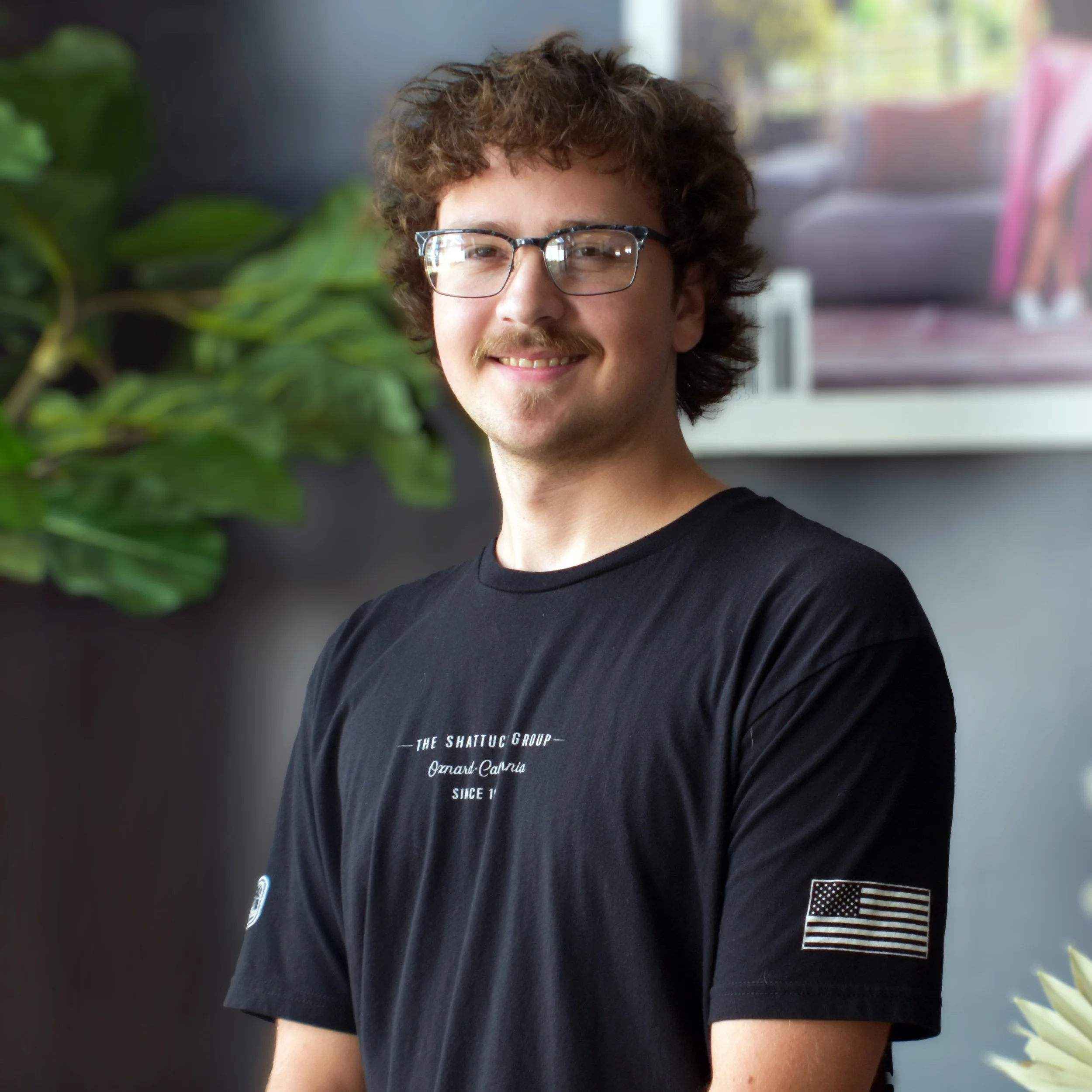 Gray-scale silhouette of a man in a suit with no facial features