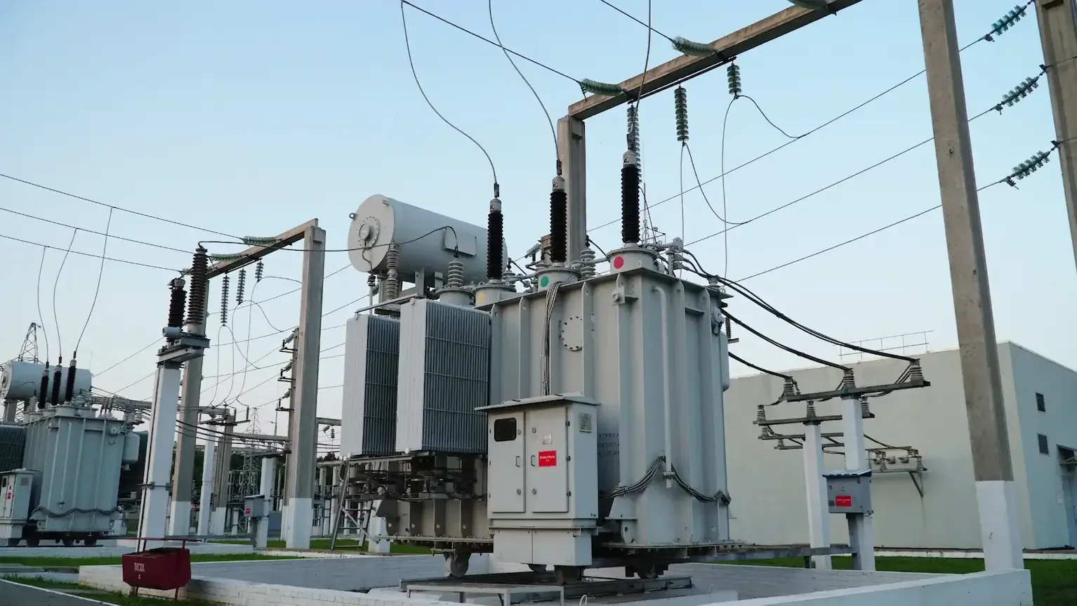 A large transformer stands in front of a power management facility