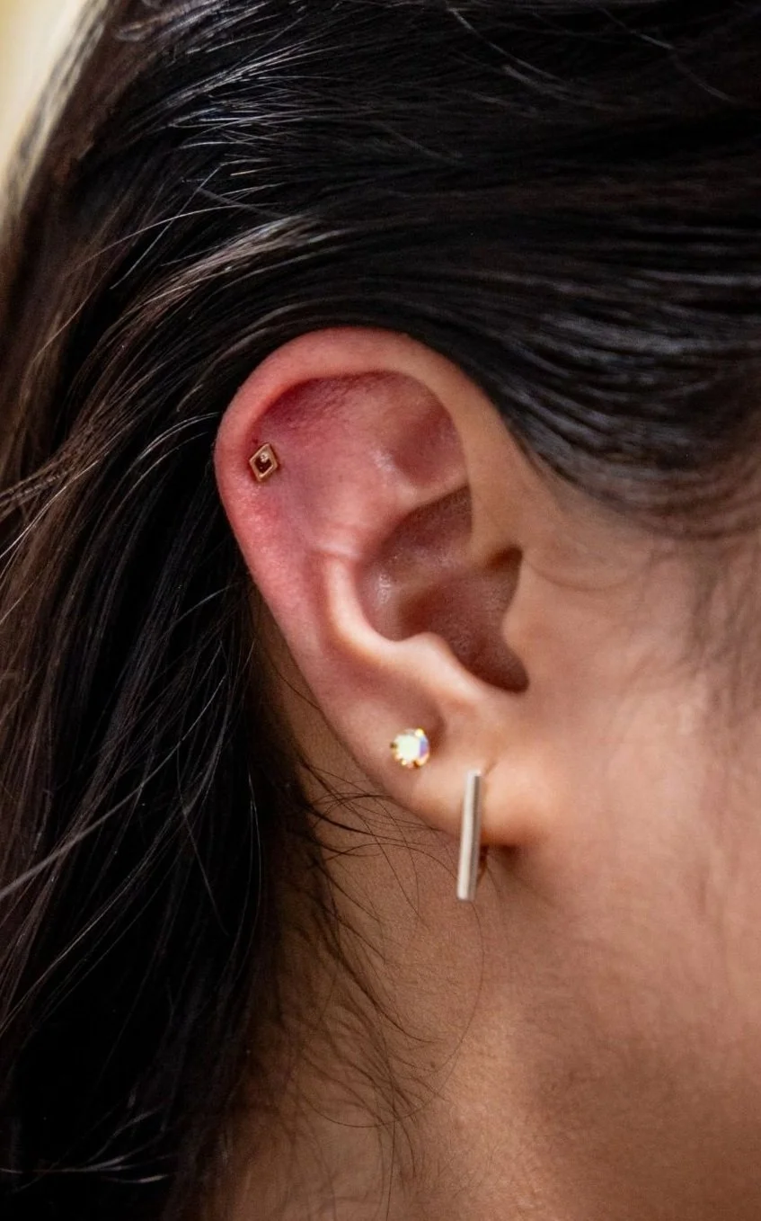 Close-up photograph of a helix piercing