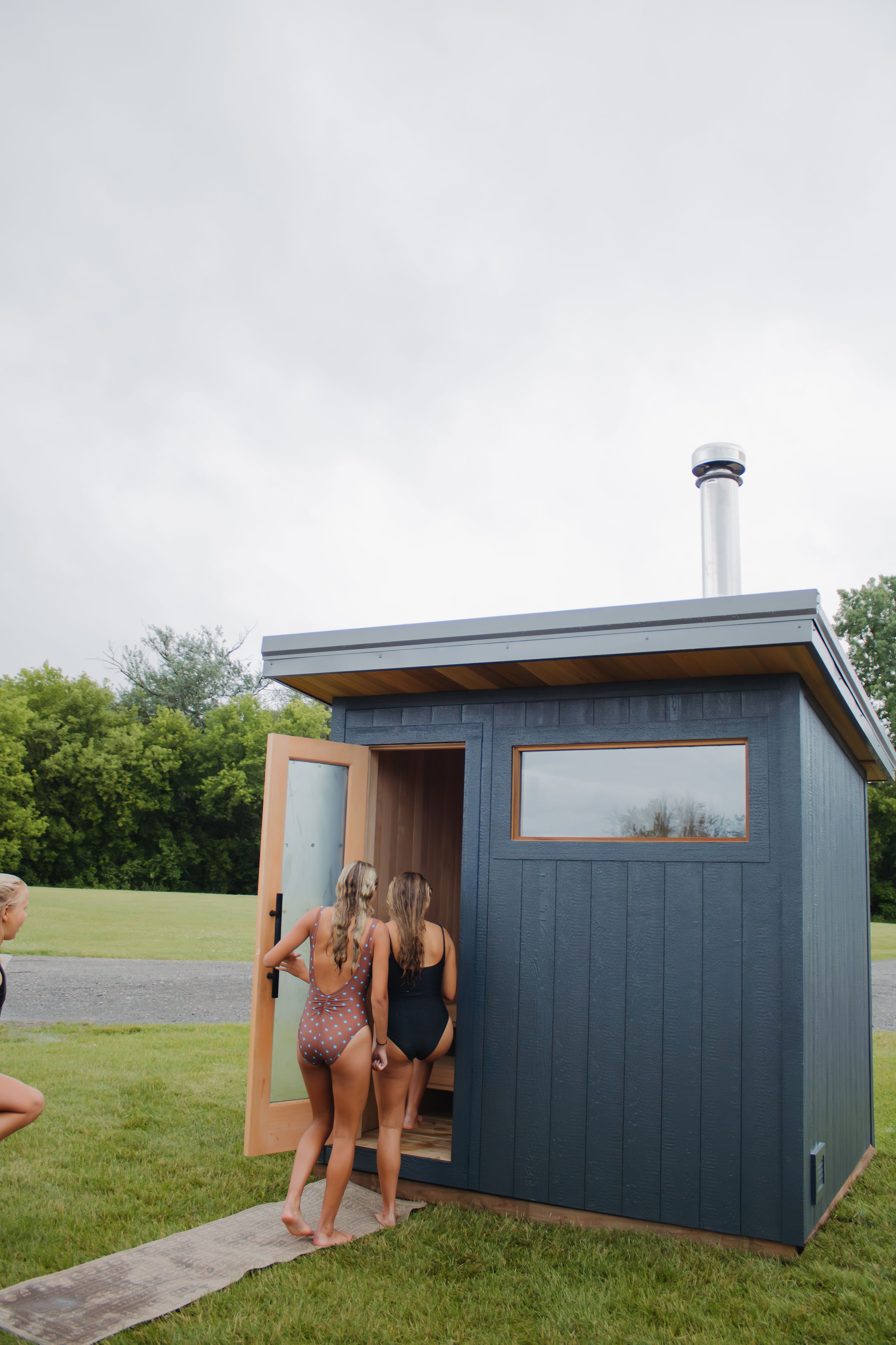Outdoor sauna in Michigan in a backyard. Six person outdoor sauna wood burning or electric with custom built options. 