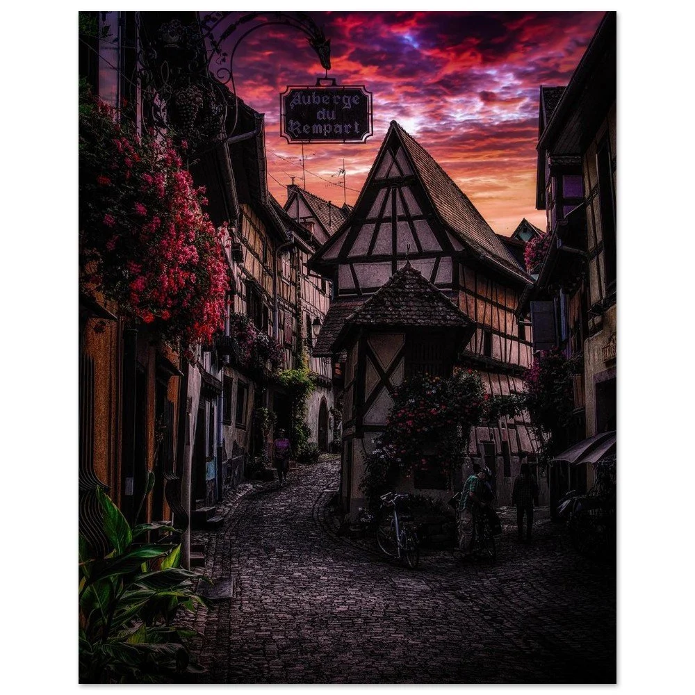 Half-timbered houses beneath a colourful evening sky in Eguisheim, Alsace, France