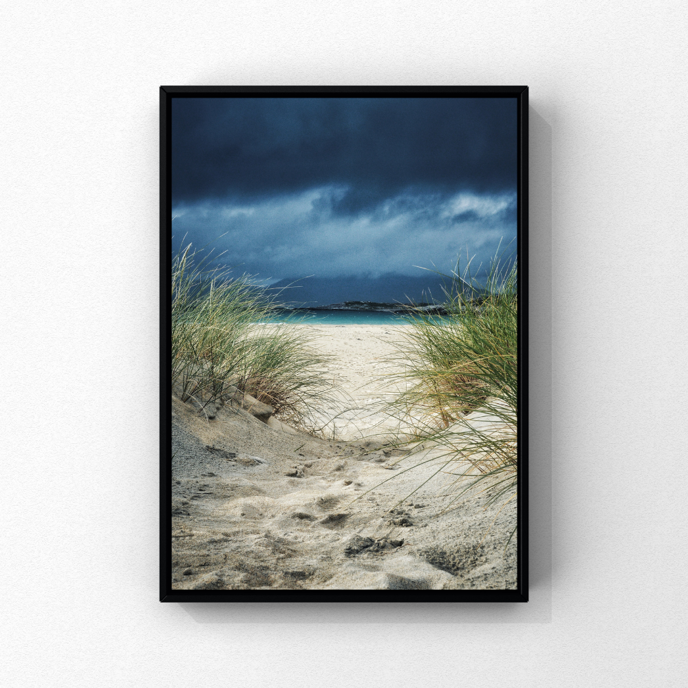 A sandy path through dunes towards turquoise sea at Luskentyre, Isle of Harris