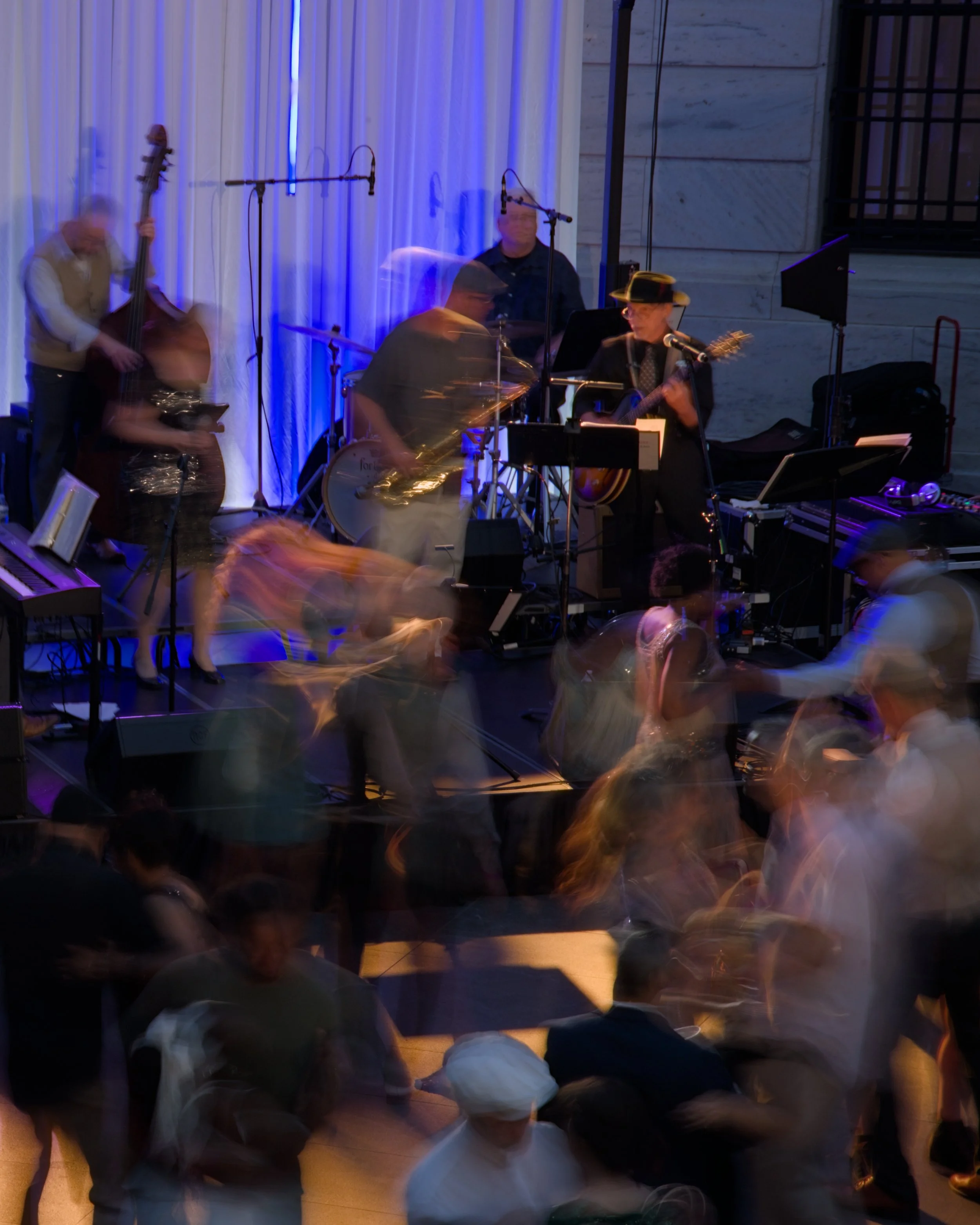 Partygoers are caught in motion at the MIX: Gatsby hosted in the Cleveland Museum of Art in Cleveland, Ohio, Aug. 1, 2025.